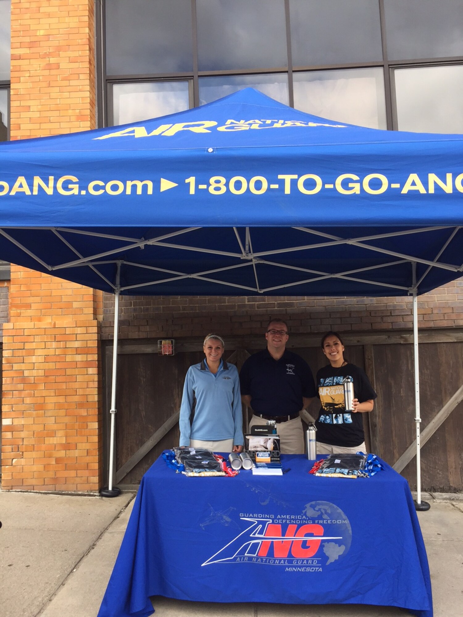 Members of recruiting hold a booth at Open Streets Minneapolis on Sunday, Aug. 23.