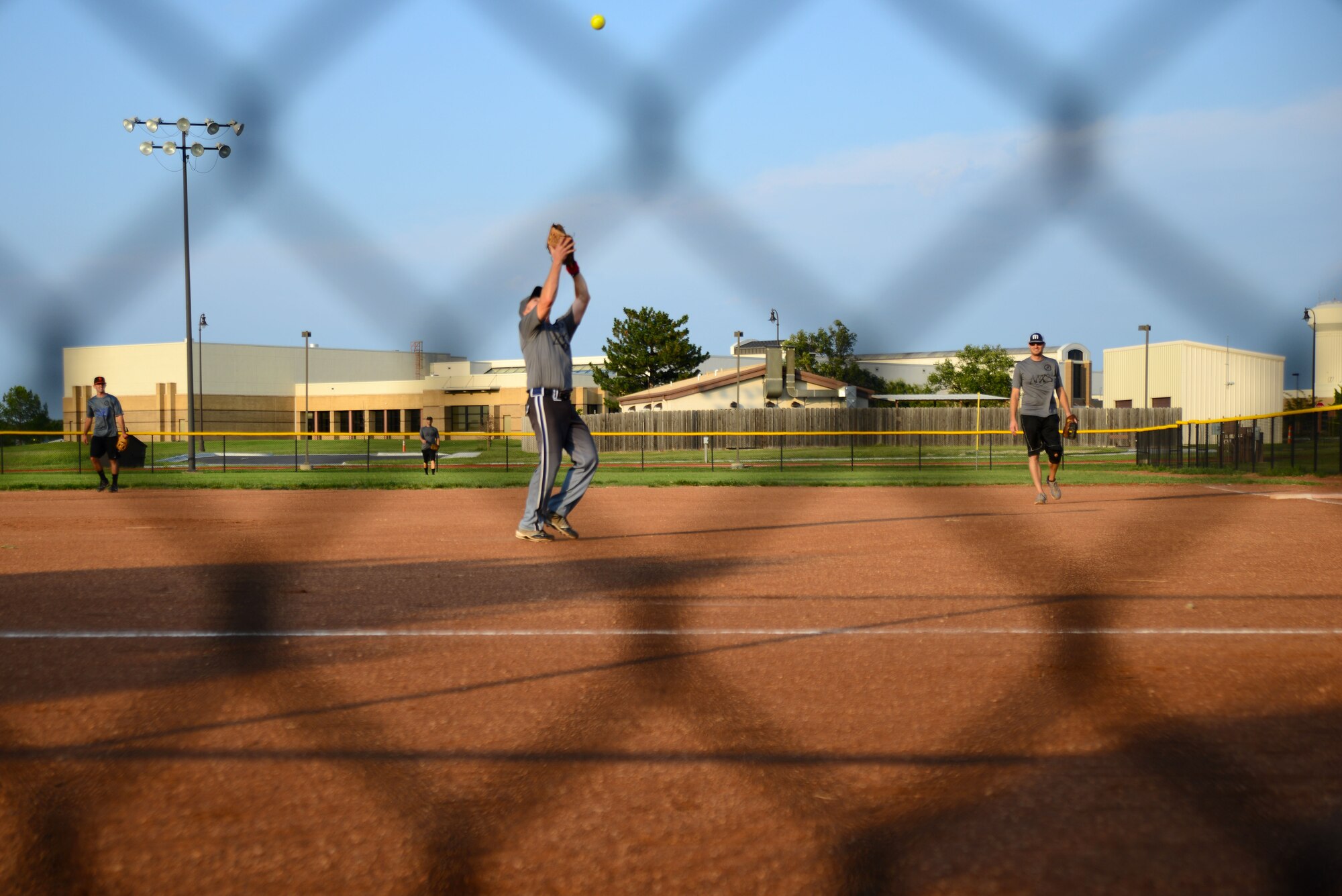 Joel Craig, 22nd Aircraft Maintenance Squadron, catches a pop-fly, Aug. 18, 2015, at McConnell Air Force Base, Kan. The 22nd AMXS led the 22nd Civil Engineer Squadron 16-8 at the end of the seventh inning. (U.S. Air Force photos by Airman1st Class Christopher Thornbury)