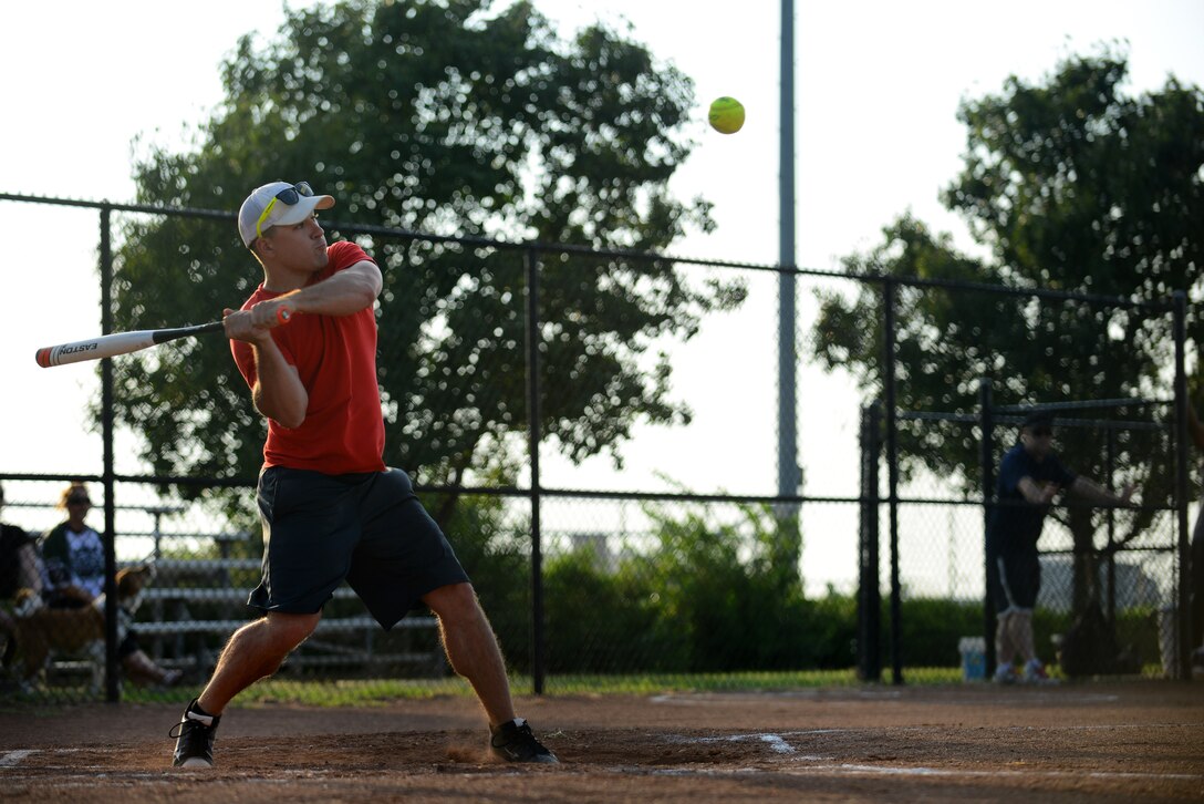 Justin Garrigus, 22nd Civil Engineer Squadron, swings at a pitch, Aug. 18, 2015, at McConnell Air Force Base, Kan. Garrigus’ hit resulted in a triple and one of four runs scored by the 22nd CES in the third inning against the 22nd Aircraft Maintenance Squadron. (U.S. Air Force photo by Airman 1st Class Christopher Thornbury) 