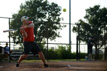 Justin Garrigus, 22nd Civil Engineer Squadron, swings at a pitch, Aug. 18, 2015, at McConnell Air Force Base, Kan. Garrigus’ hit resulted in a triple and one of four runs scored by the 22nd CES in the third inning against the 22nd Aircraft Maintenance Squadron. (U.S. Air Force photo by Airman 1st Class Christopher Thornbury) 