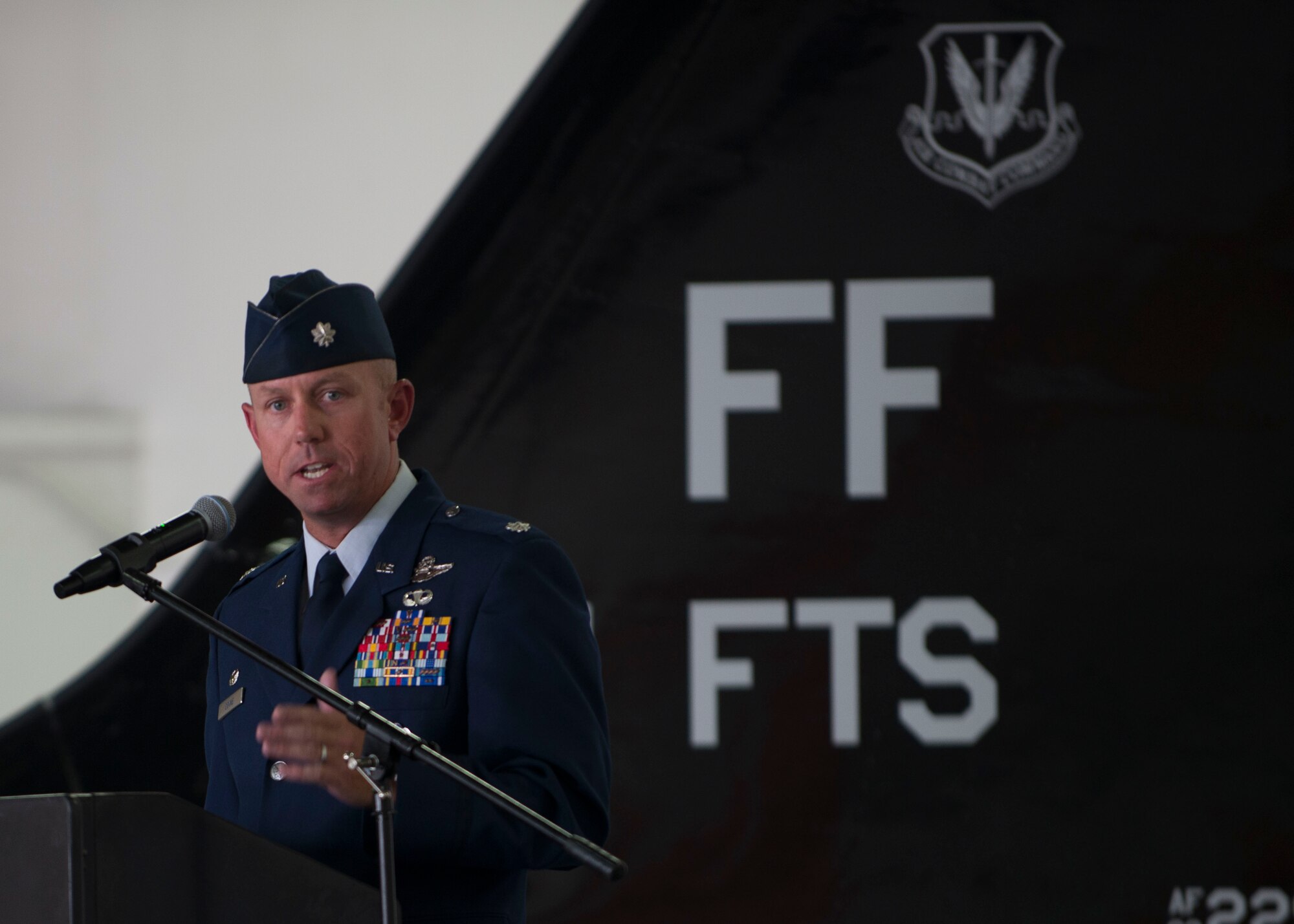 U.S. Air Force Lt. Col. Brian Coyne, 71st Fighter Training Squadron commander, speaks during the unit’s reactivation ceremony at Langley Air Force Base, Va., Aug. 21, 2015. Over the course of its history, the 71st Fighter Squadron saw combat in numerous conflicts across the globe including World War II, Operations Northern Watch, Southern Watch and Iraqi Freedom, and was credited with the first air-to-air victory in Desert Storm and earned numerous accolades, including three Presidential Unit Citations, eleven Air Force Outstanding Unit Awards and five Hughes Achievement Trophies. (U.S. Air Force photo by Staff Sgt. John D. Strong II/Released)