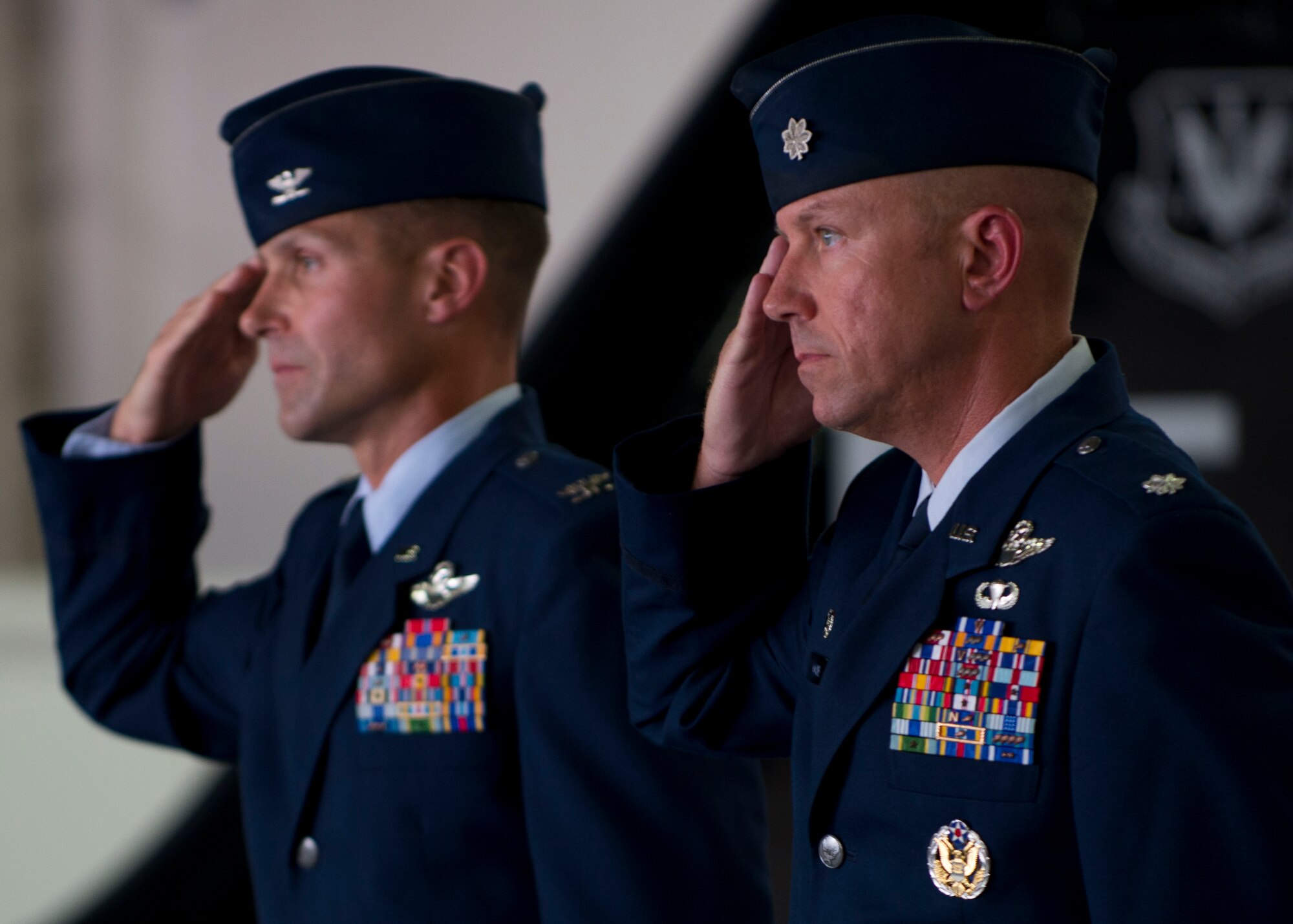 U.S. Air Force Col. Larry Broadwell, 1st Operations Group commander, and Lt. Col. Brian Coyne salute during the 71st Fighter Squadron reactivation ceremony at Langley Air Force Base, Va., Aug. 21, 2015. The 71st FS was deactivated in September 2010 as the 1st Fighter Wing moved from the F-15C Eagle to the fifth generation F-22 Raptor. (U.S. Air Force photo by Staff Sgt. John D. Strong II/Released)