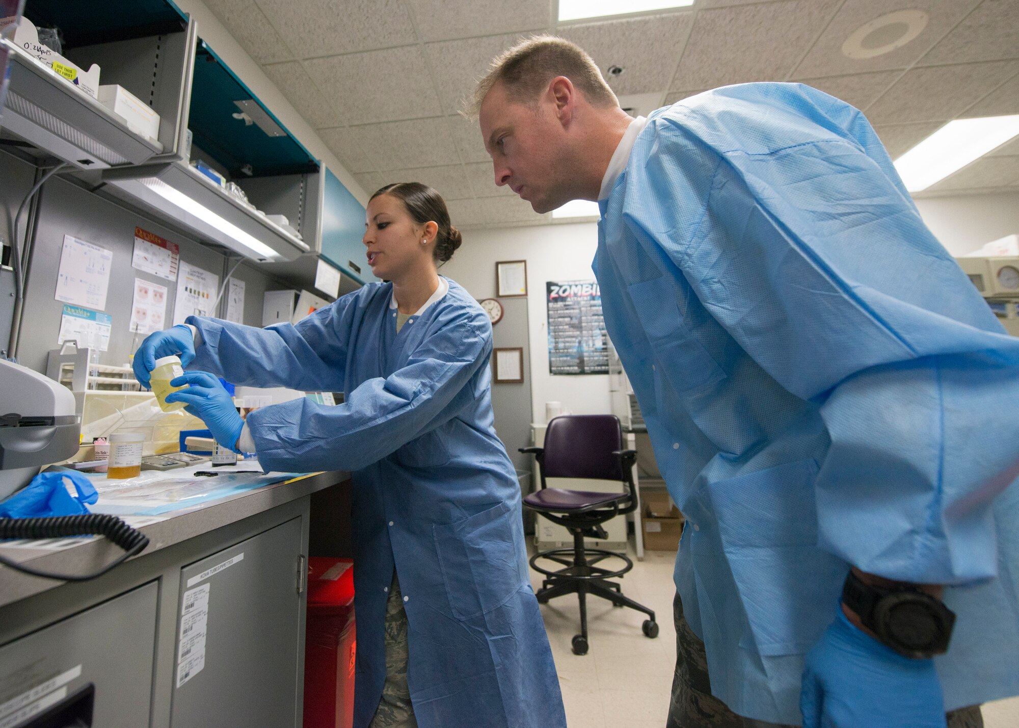 Airman 1st Class Gabriele Santini, a 49th Medical Group medical laboratory technician, tests and analyzes urine samples at Holloman Air Force Base, N.M., Aug. 19 for Col. Robert Kiebler, the 49th Wing commander. Every week, the wing commander and the wing command chief make a face-to-face and hands-on visit to different parts of the base to get to know airmen and learn about their contribution to the mission. This week’s trip to the 49th Medical Group was focused on the medical laboratory where they learned about phlebotomy, urinalysis, hematology and chemistry. (U.S. Air Force photo by Senior Airman Aaron Montoya)