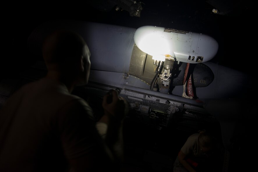 U.S. Air Force Airman 1st Class Matthew Whitmer, 41st Helicopter Maintenance Unit crew chief, inspects the hydraulic hoist on an HH-60G Pave Hawk during post-flight inspections Aug. 20, 2015, at Moody Air Force Base, Ga. Whitmer inspected the hoist by lowering the 300-foot cable and checking it for frays and damage. (U.S. Air Force photo by Airman 1st Class Dillian Bamman/Released)