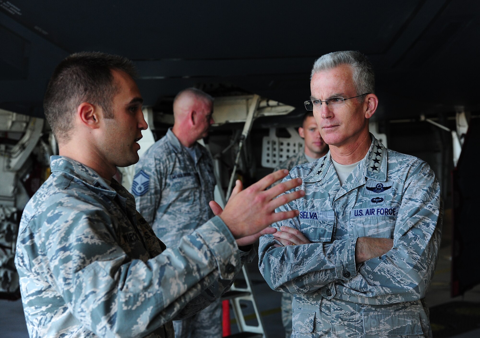 Capt. Corey Wiechmann, 509th Aircraft Maintenance Squadron, speaks with Gen. Paul J. Selva, 10th Vice Chairman of the Joint Chiefs of Staff, Aug. 21, 2015 at Whiteman Air Force Base, Mo. Selva visited several units on base and was given a tour of a B-2 Spirit. (U.S. Air Force photo by Senior Airman Joel Pfiester/Released)
