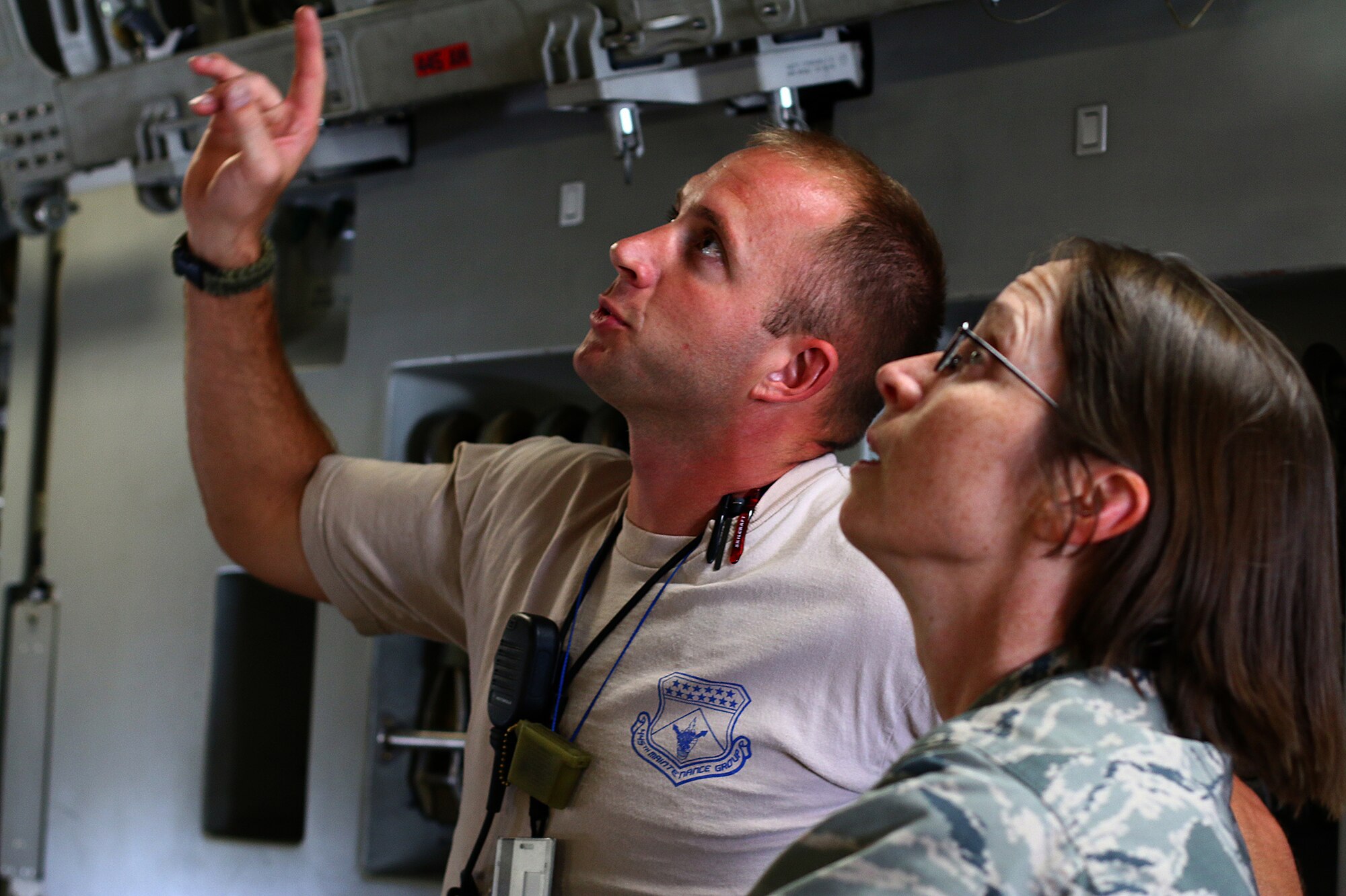 WRIGHT-PATTERSON AFB, Ohio – Tech. Sgt. Chris Falloon, 445th Aircraft Maintenance Squadron, explains to Col. Elena M. Oberg, 88th Air Base Wing vice commander,  the maintenance aspects of a 445th Airlift Wing C–17 Globemaster III Aug. 21, 2015. Oberg was a guest along with civic leaders from Dyess Air Force Base, Texas area who made a stop at Wright-Patterson AFB to tour the base and the National Museum of the U.S. Air Force Aug. 20-21. The civic leader program is designed to showcase the important work citizen airmen and the Air Force Reserve do for our nation. (U.S. Air Force photo/Tech. Sgt. Patrick O’Reilly)