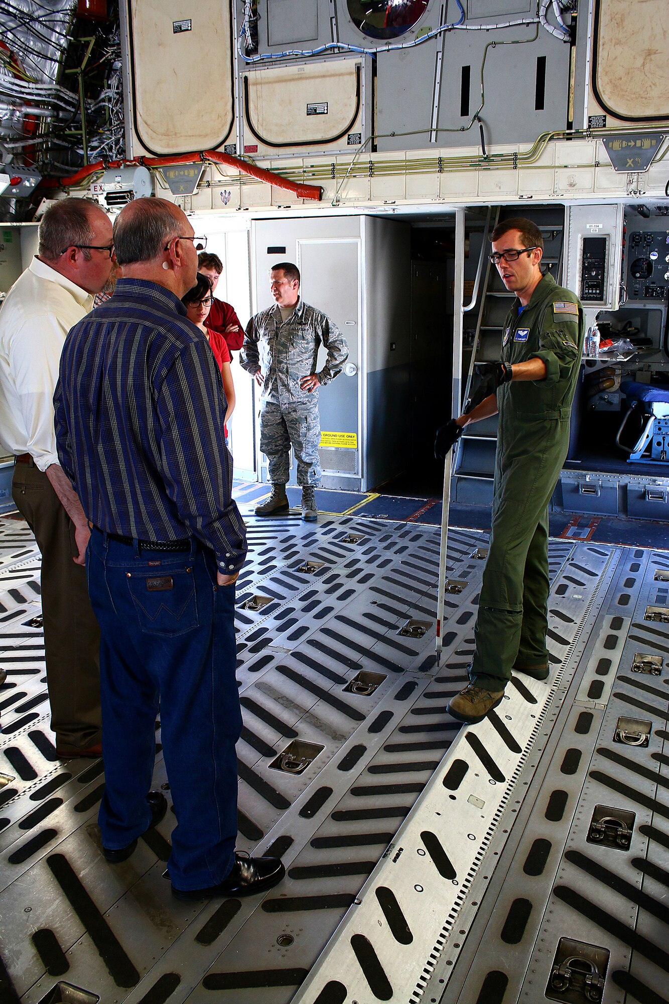 WRIGHT-PATTERSON AFB, Ohio – Senior Airman Shawn Haggerty, 89th Airlift Squadron loadmaster, shows civic leaders from Dyess Air Force Base, Texas area how cargo can be loaded onto the C–17 Globemaster III during their visit to the 445th Airlift Wing Aug. 21, 2015. The civic leader group made a stop at Wright-Patterson AFB to tour the base and the National Museum of the U.S. Air Force Aug. 20-21. The civic leader program is designed to showcase the important work citizen airmen and the Air Force Reserve do for our nation. (U.S. Air Force photo/Tech. Sgt. Patrick O’Reilly)