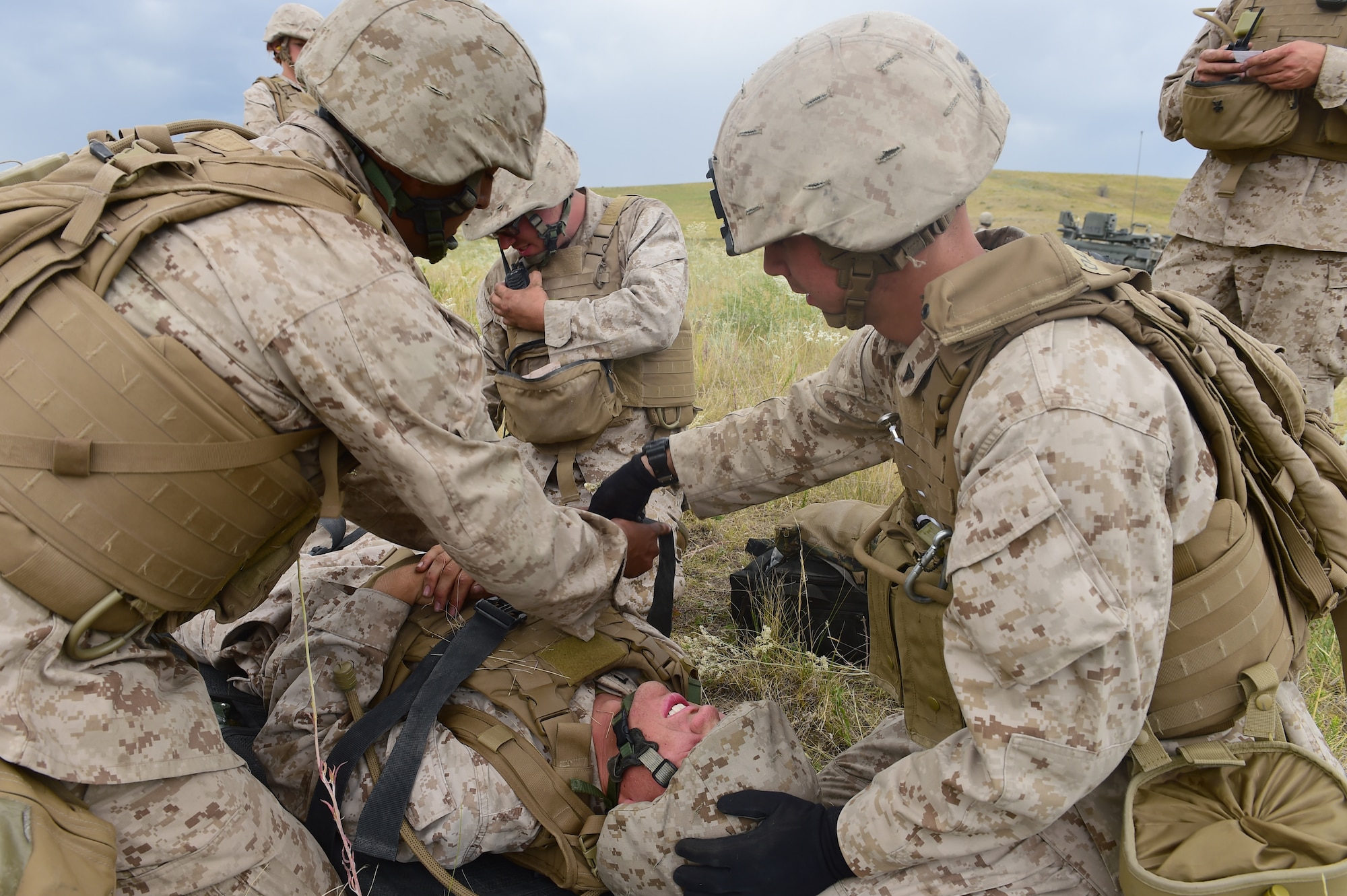Marines from Quebec Battery, 5th Battalion 14 Marines, practice transporting a wounded Marine Aug. 15, 2015, in Guernsey, Wyoming. Practicing the correct procedures when caring for and transporting a wounded Marine can save lives during combat. (U.S. Air Force photo by Airman 1st Class Luke W. Nowakowski/Released)