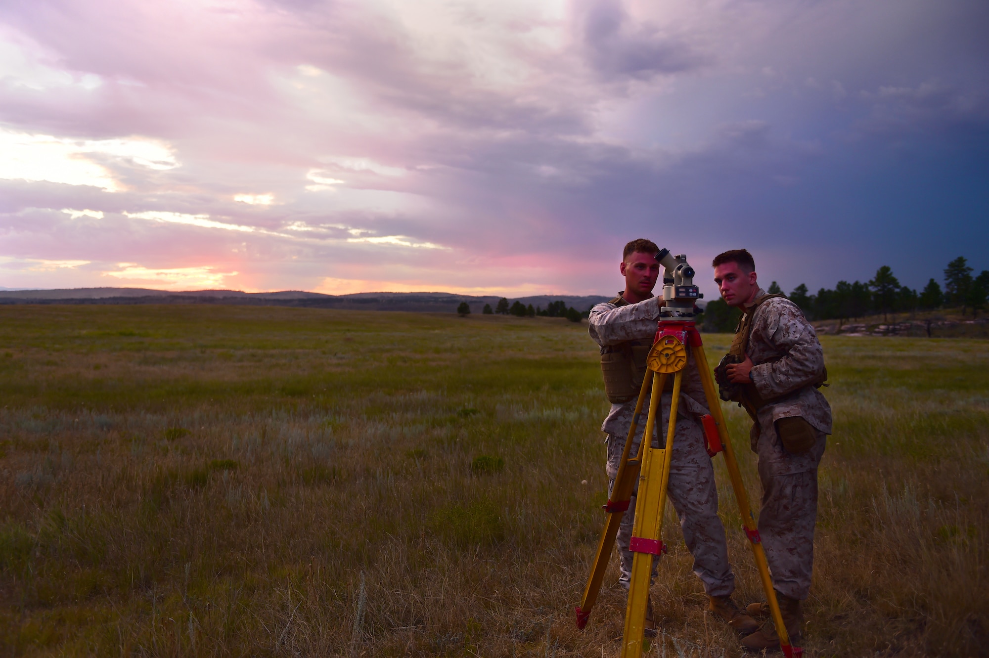 Sgt. John Frost and Lance Cpl. Joshua Weemes, Quebec Battery, 5th Battalion 14 Marines fire direction center, conduct measurements Aug. 14, 2015, in Guernsey, Wyoming. These Marines use meteorological equipment to collect data that will be used in the calculations that determine the angles of an artillery gun before firing. (U.S. Air Force photo by Airman 1st Class Luke W. Nowakowski/Released)