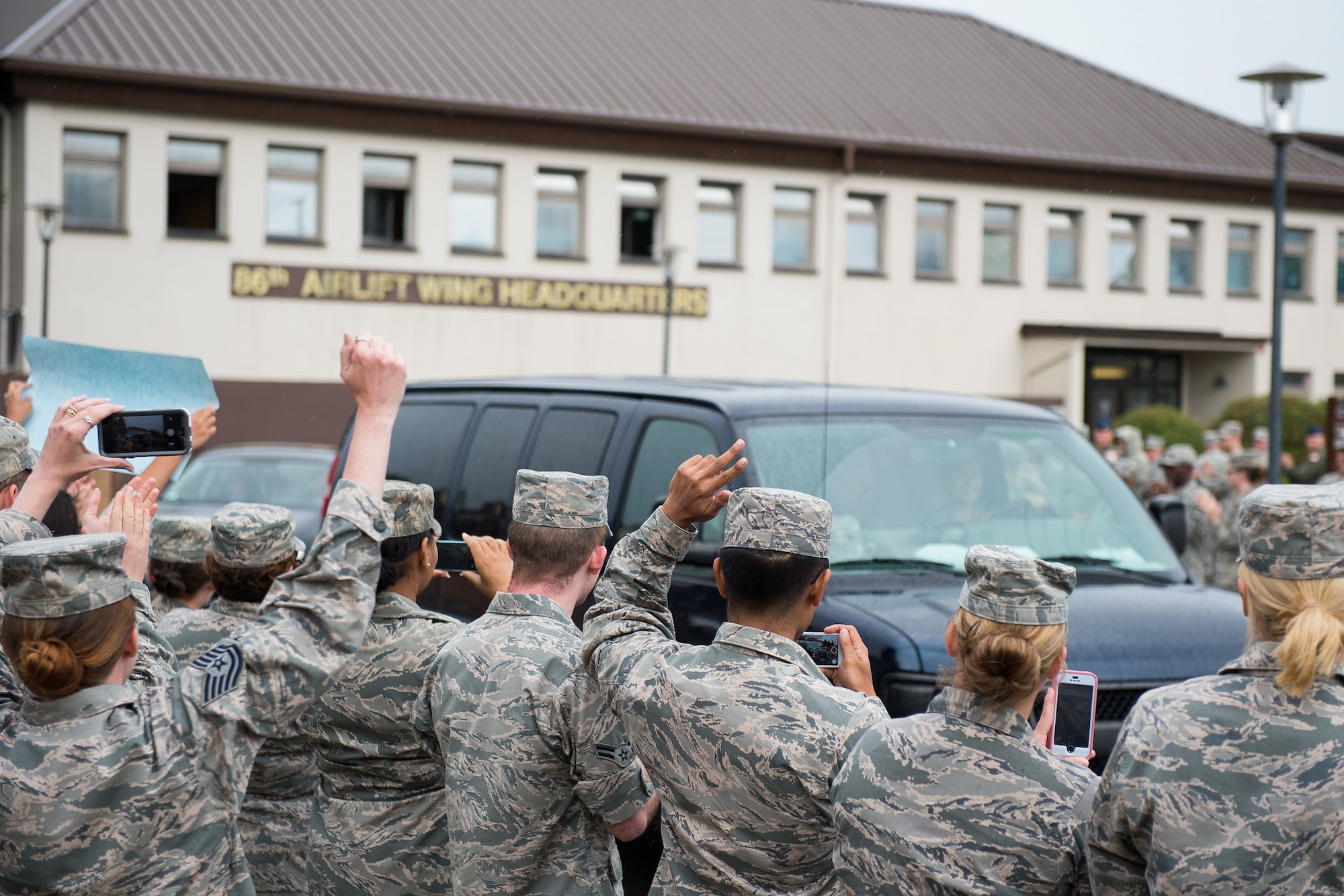 Airman 1st Class Spencer Stone is greeted with a "Heroic Welcome" as he and Oregon National Guardsman Aleksander Skarlatos arrive at Ramstein Air Base, Germany, Aug. 24. 2015. More than 200 Airmen and their families came out to line the streets and thank Stone and his friends for their bravery. Stone arrived at Ramstein while in transit to Landstuhl Regional Medical Center for follow-on medical treatment. Stone received multiple injuries, all of which were non-life threatening, while subduing an armed gunman on a train traveling from Amsterdam to Paris. Stone is an ambulance service technician with the 65th Medical Operations Squadron stationed at Lajes Field, Azores. (U.S. Air Force photo/Senior Airman Damon Kasberg)