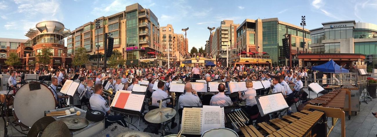 The Concert Band and Singing Sergeants, led by Colonel Larry Lang, performed a concert of World War II-era music for an enthusiastic crowd at National Harbor.  The music honored the "Greatest Generation" on the 70th Anniversary of the end of the war. (U.S. Air Force Photo by Technical Sgt. Adam Green/released)