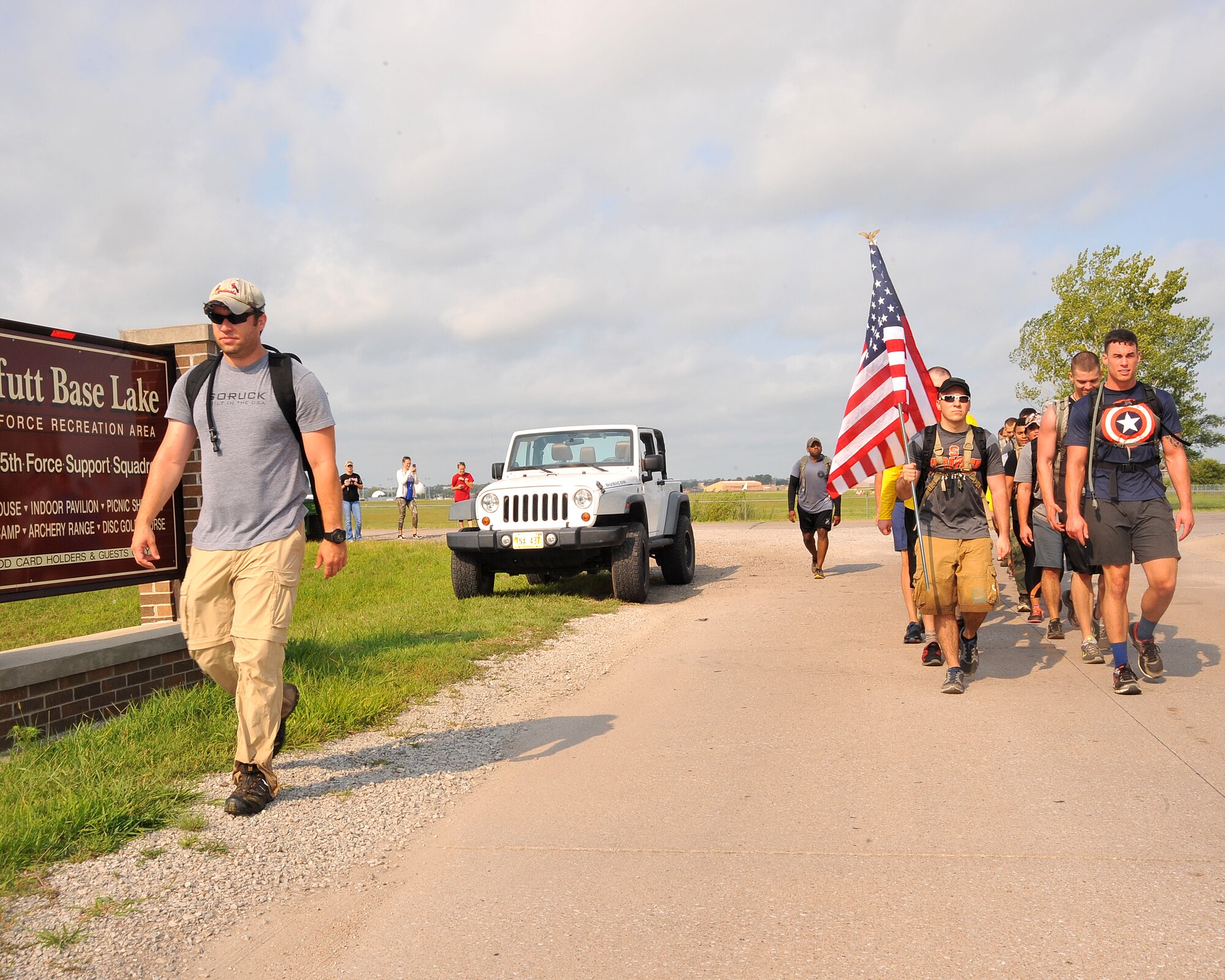 A U.S. Air Force special operations operator leads a group of participants in the Team Cohesion Challenge held on Aug. 22, 2015, at Offutt Air Force Base, Nebraska. The challenge is physically demanding which promotes a 'hard work in, positive results out" message. (U.S. Air Force photo by D.P. Heard/Released)