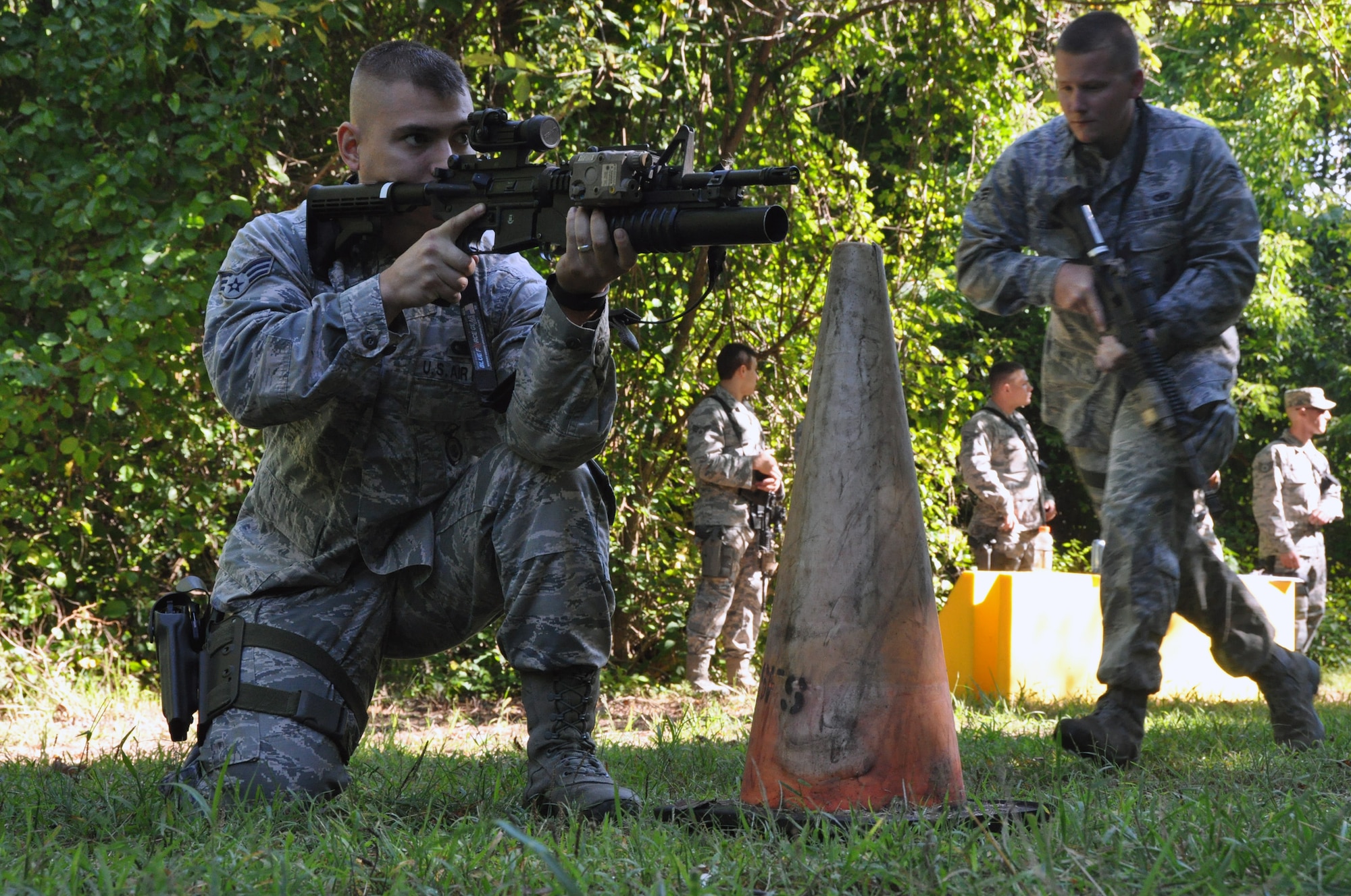 Members of the 911th Security Forces Squadron participate in shoot, move and communicate drills during the second August Unit Training Assembly, at the firing range in Clinton, Pennsylvania, Aug. 22, 2015. The purpose of the drills is to train in weapons safety, fulfill bi-annual certification in tactics, and build key communication skills between team members in enemy engagement simulations. (U.S. Air Force photo by Senior Airman Joseph E. Bridge) 