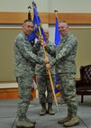 Col. Robert Frederiksen, right, accepts command of the 341st Security Forces Group from Col. Tom Wilcox, 341st Missile Wing commander Aug. 21, 2015, at Malmstrom Air Force Base, Mont. Chief Master Sgt. Jeremy Sutfin, 341st SFG group superintendent, center, looks on. (U.S. Air Force photo/John Turner)