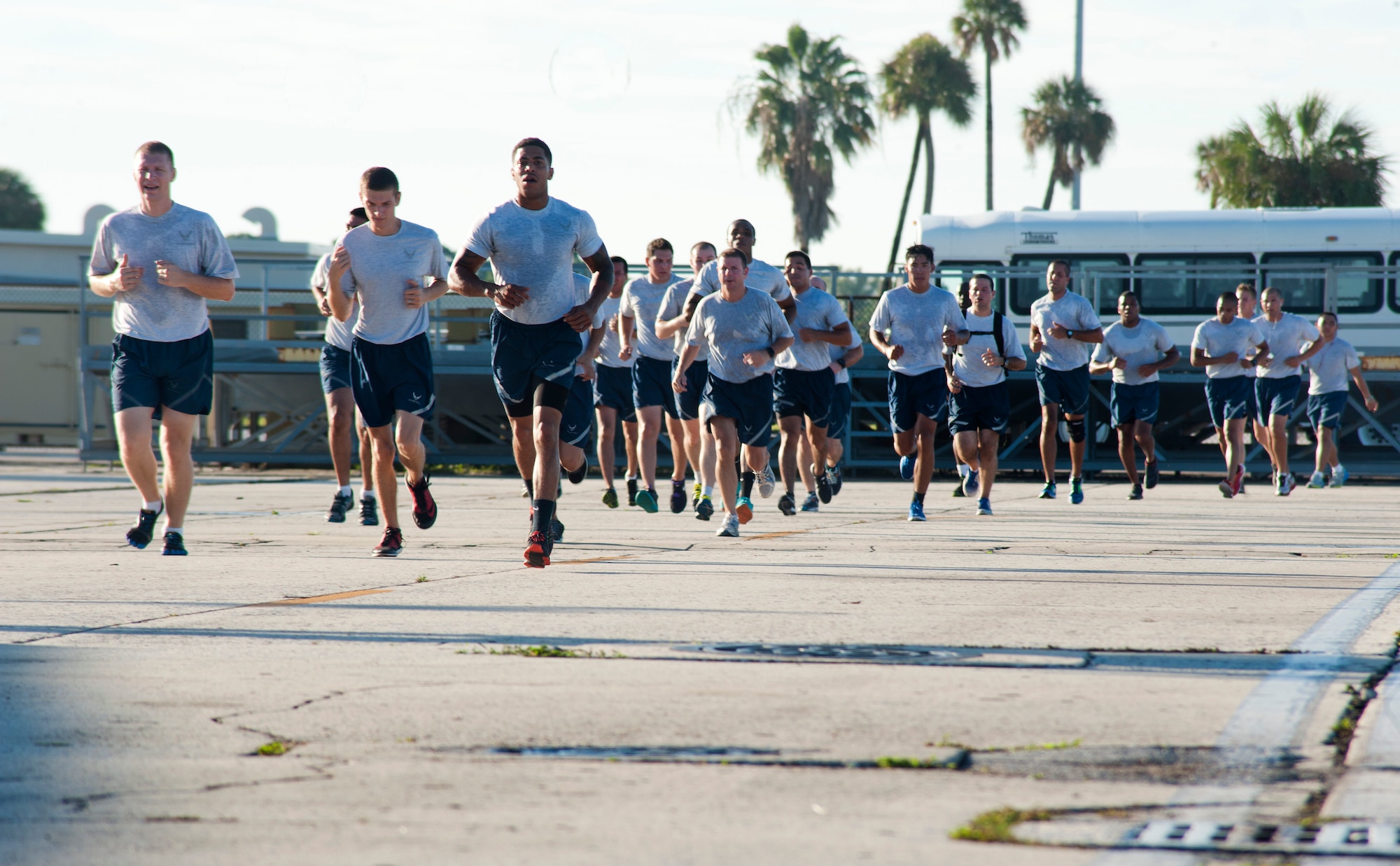 Airmen from Team MacDill  participate in a flightline 5K run on Wingman Day August 17, 2015, at MacDill Air Force Base, Fla. MacDill hosts two Wingman Days throughout the year to ensure that Airmen are knowledgeable and exercising Comprehensive Airman Fitness. (U.S. Air Force photo by Senior Airman Jenay Randolph/Released)  