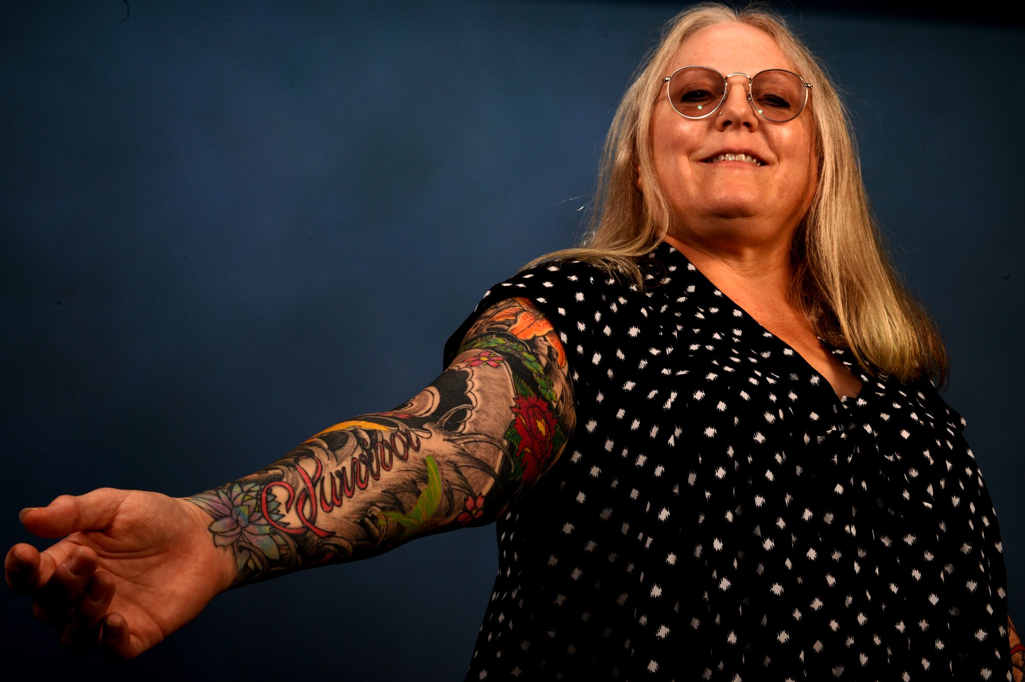 Jenyfer Johnson, 20th Civil Engineer Squadron hazardous material and waste manager, displays her “survivor” tattoo, Shaw Air Force Base, S.C., Aug. 17, 2015. Johnson is now in remission after battling breast cancer in 2009. (U.S. Air Force photo by Senior Airman Jonathan Bass/Released)