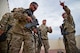 Master Sgt. Paul Morales, 919th Special Operations Security Forces Squadron, discusses building-clearing techniques with his team during the squadron’s annual training at Camp Guernsey, Wyo., Aug. 3.  More than 20 Airmen went out West to help train two other Reserve security forces squadrons in ground combat and field training.  The 919th SOSFS Airmen lived in the makeshift camps and acted as opposing forces and local villagers interacting with the occupying security teams. (U.S. Air Force photo/Tech. Sgt. Sam King)