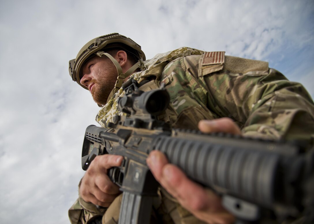 Senior Airman Aaron Bradley, 919th Special Operations Security Forces Squadron, looks out over the vast landscape during the squadron’s annual training at Camp Guernsey, Wyo., Aug. 3.  More than 20 Airmen went out West to help train two other Reserve security forces squadrons in ground combat and field training.  The 919th SOSFS Airmen lived in the makeshift camps and acted as opposing forces and local villagers interacting with the occupying security teams. (U.S. Air Force photo/Tech. Sgt. Sam King)