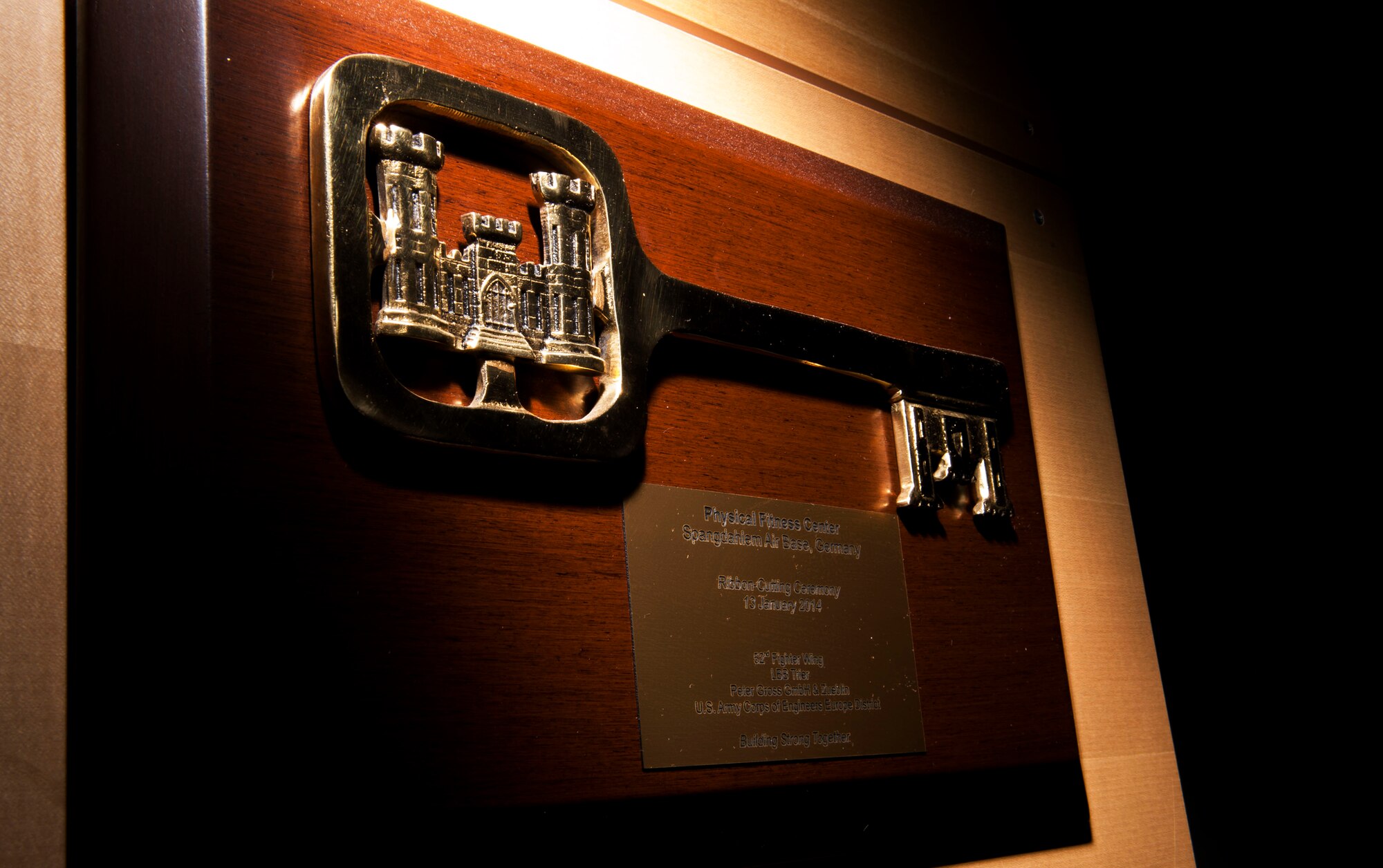 A key plaque remains on display at the Eifel Powerhaus on Spangdahlem Air Base, Germany, Aug. 20, 2015. The 52nd Force Support Squadron supports the men and women of the 52nd Fighter Wing and their families, as well as geographically separated units, with a service that enhances the physical and mental fitness of base community members. (U.S. Air Force photo by Airman 1st Class Timothy Kim/Released)