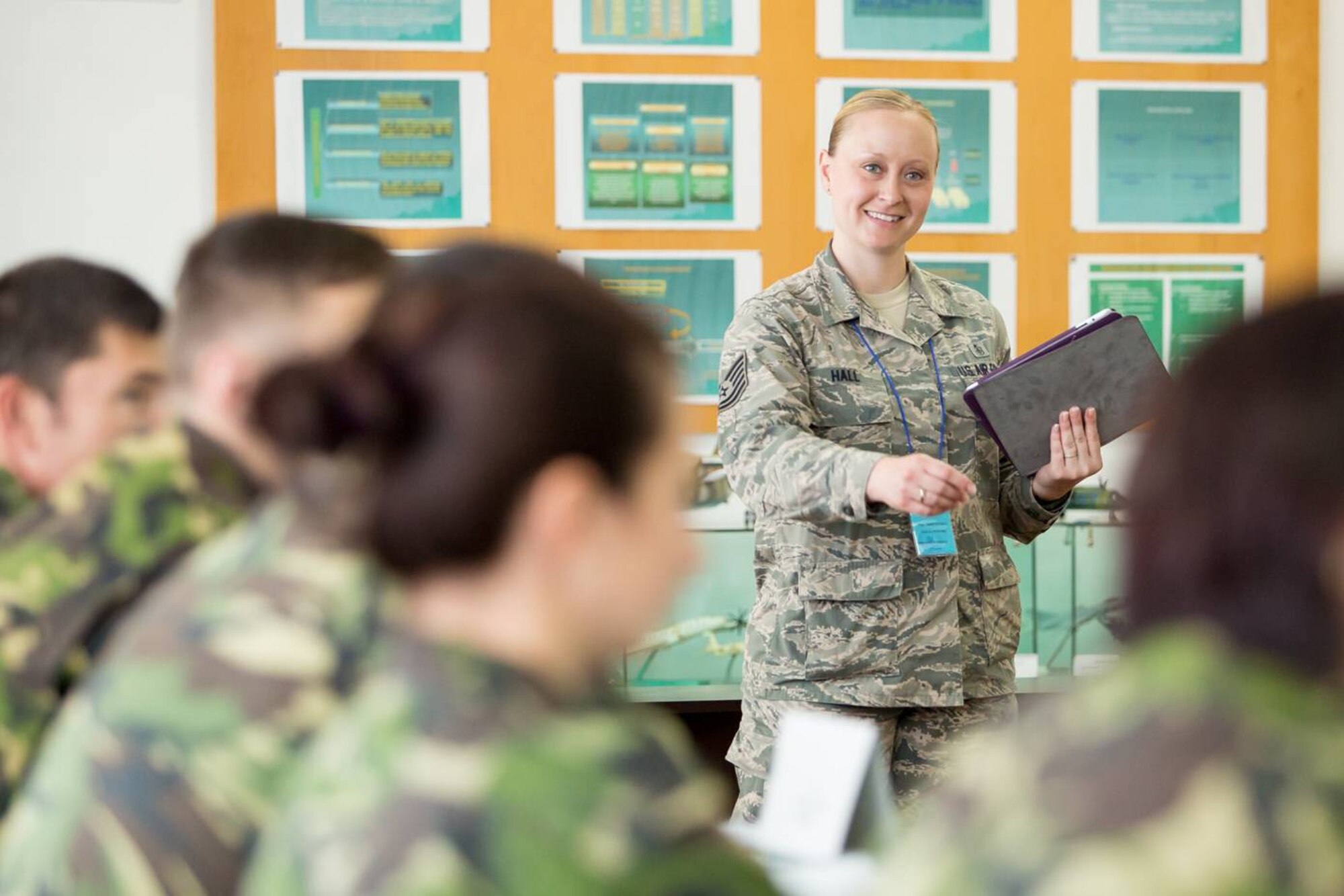 U.S. Air Force Tech. Sgt. Tamera Hall, Kisling NCO Academy instructor, teaches a class of Romanian students during an week long course at Boboc Air Force Base, Romania, July 3, 2015. Hall and a fellow instructor taught 12 Romanian students how the U.S. develops their NCOs educations. The trip helped build relationships between the two allies and promoted learning and cultural understanding.(U.S. Air Force courtesy photo/Senior Master Sgt. Daniel Kenemore) 