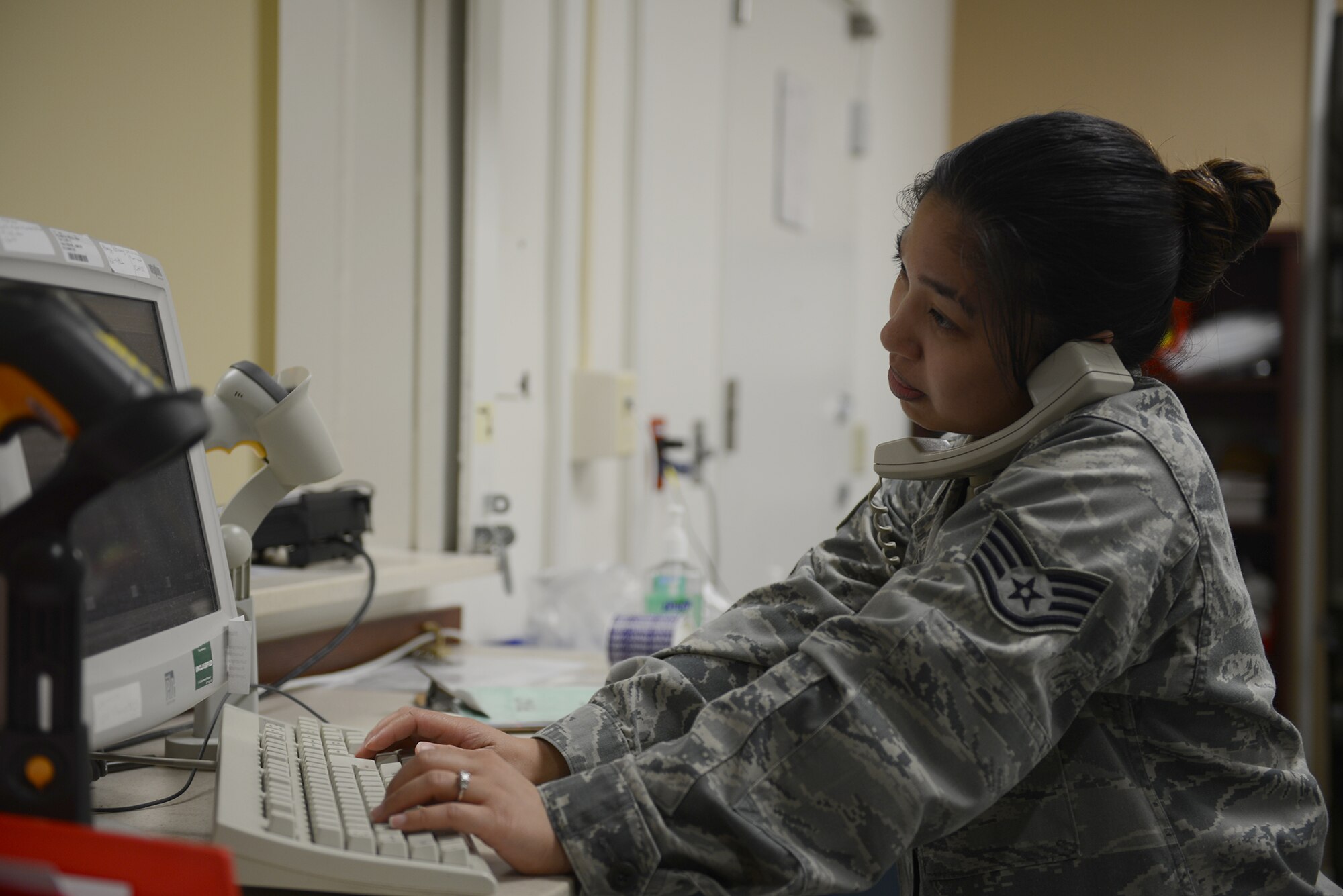 Staff Sgt. Tammi Aronce, 374th Medical Support Squadron pharmacy technician, coordinates prescription orders at Yokota Air Base, Japan, Aug. 19, 2015. The pharmacy serves 11,000 beneficiaries, including active duty service members, dependents and civilians. (U.S. Air Force photo by Senior Airman David C. Danford/Released)