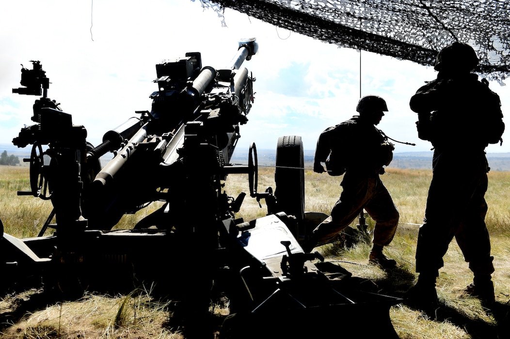 Lance Cpl. Nathaniel Cintron, 5th Battalion 14 Marines cannoneer, pulls a lanyard to activate the firing mechanism in the M777 A2 Howitzer Aug. 15, 2015, in Guernsey, Wyoming. As the number one man on the gun, his job is to fire the M777 A2 Howitzer when given the command ‘fire’ by the gun chief. (U.S. Air Force photo by Airman 1st Class Luke W. Nowakowski/Released)