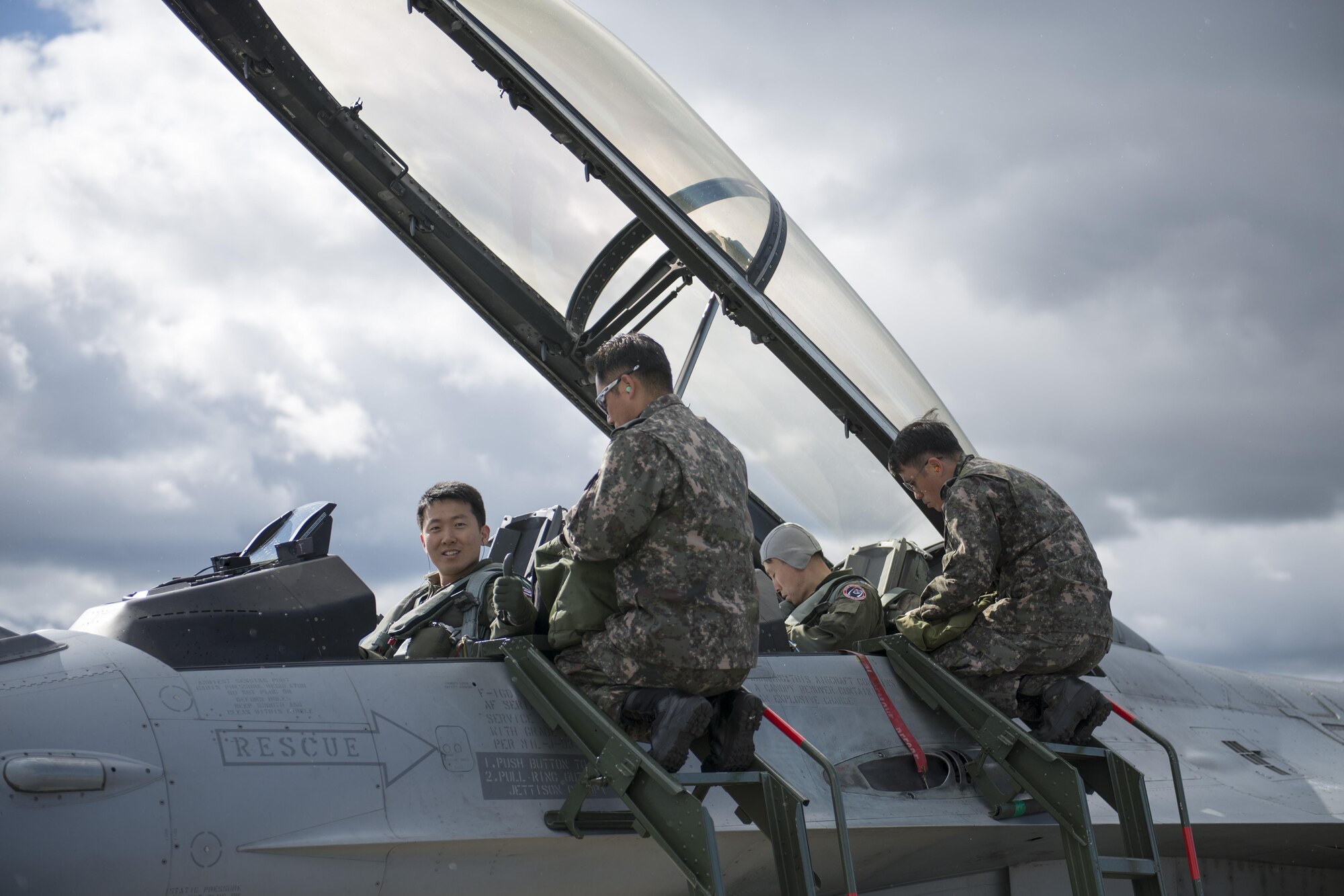 Republic of Korea Air Force (ROKAF) Majs. Lee Jong Won and Lee Dong Seop, both ROKAF F-16D Fighting Falcon pilots, ensure their equipment is secured prior to the launch of a RED FLAG-Alaska (RF-A) 15-3 sortie, Aug. 11, 2015 from Eielson Air Force Base, Alaska. Units from across the Department of Defense and allied forces have utilized the Joint Pacific Alaska Range Complex’s 67,000 square miles of airspace for RED FLAG-Alaska since 2006 because it is the largest instrumented air, ground and electronic combat training range in the world. (U.S. Air Force photo by 1st Lt. Elias Zani/Released)