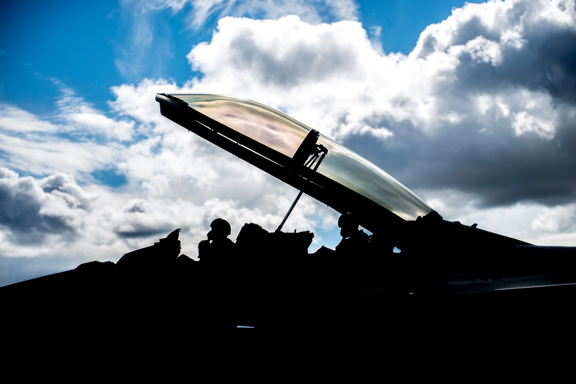 Republic of Korea Air Force (ROKAF) Majs. Lee Jong Won and Lee Dong Seop, both ROKAF F-16D Fighting Falcon pilots, ensure their equipment is secured prior to the launch of a RED FLAG-Alaska (RF-A) 15-3 sortie, Aug. 11, 2015 from Eielson Air Force Base, Alaska. Units from across the Department of Defense and allied forces have utilized the Joint Pacific Alaska Range Complex’s 67,000 square miles of airspace for RED FLAG-Alaska since 2006 because it is the largest instrumented air, ground and electronic combat training range in the world. (U.S. Air Force photo illustration by 1st Lt. Elias Zani/Released)
