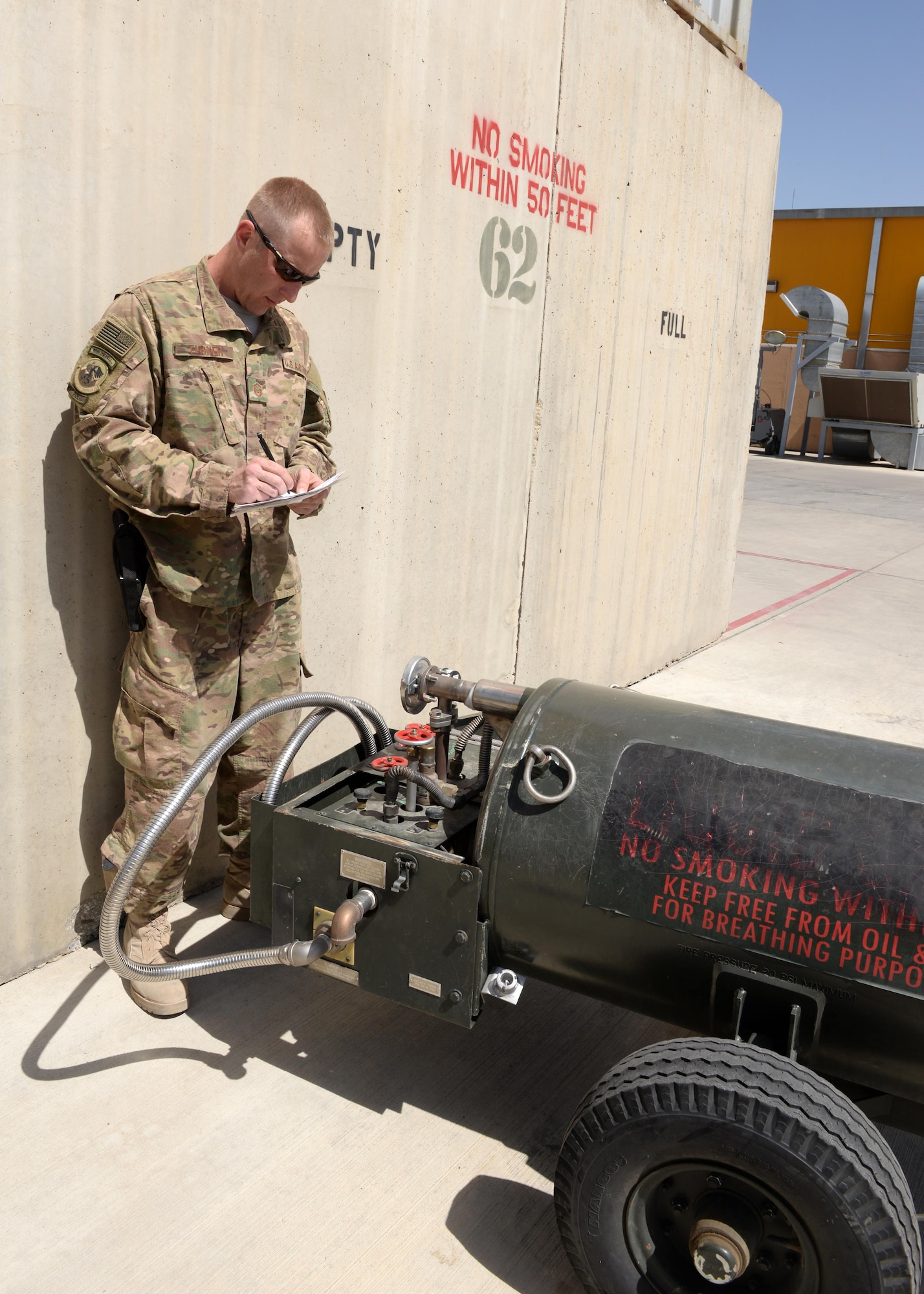 U.S. Air Force Master Sgt. Benjamin Turner, 455th Logistics Readiness Squadron fuels operations section chief, documents information from a liquid nitrogen tank Aug. 22, 2015, at Bagram Airfield, Afghanistan. Turner is a part of the fuels flight and is one of ten military members who work with contractors from the Ingenuity and Purpose contracting company who is responsible for fueling all aircraft on Bagram. (U.S. Air Force photo by Senior Airman Cierra Presentado/Released)