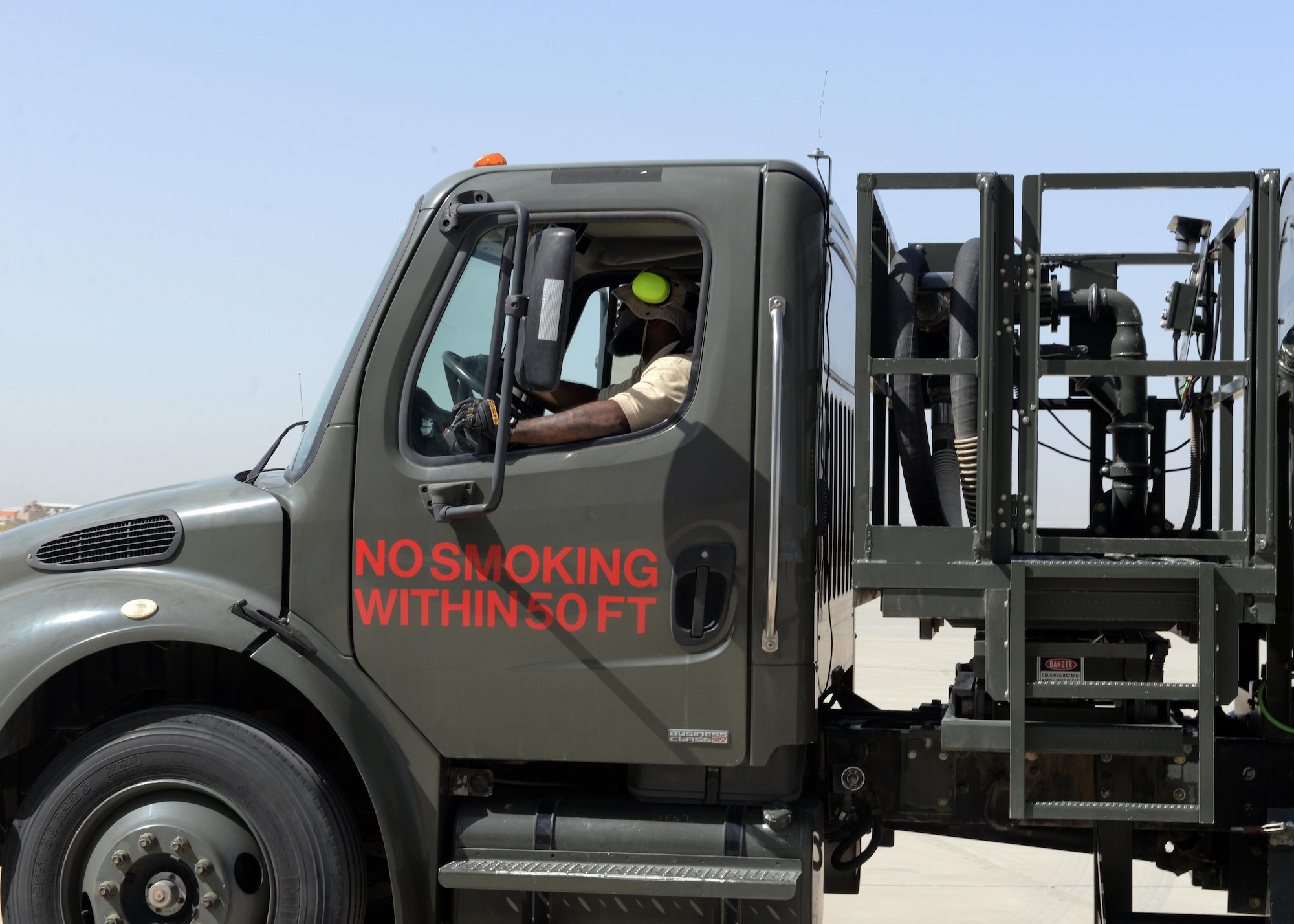 John Jackson, 455th Expeditionary Logistics Readiness Squadron fuels technician, drives an R-12 fuel truck to an aircraft Aug. 22, 2015, at Bagram Airfield, Afghanistan. Jackson is a contractor with the Ingenuity and Purpose contracting company and is responsible for fueling all aircraft that come to and from Bagram. (U.S. Air Force photo by Senior Airman Cierra Presentado/Released)