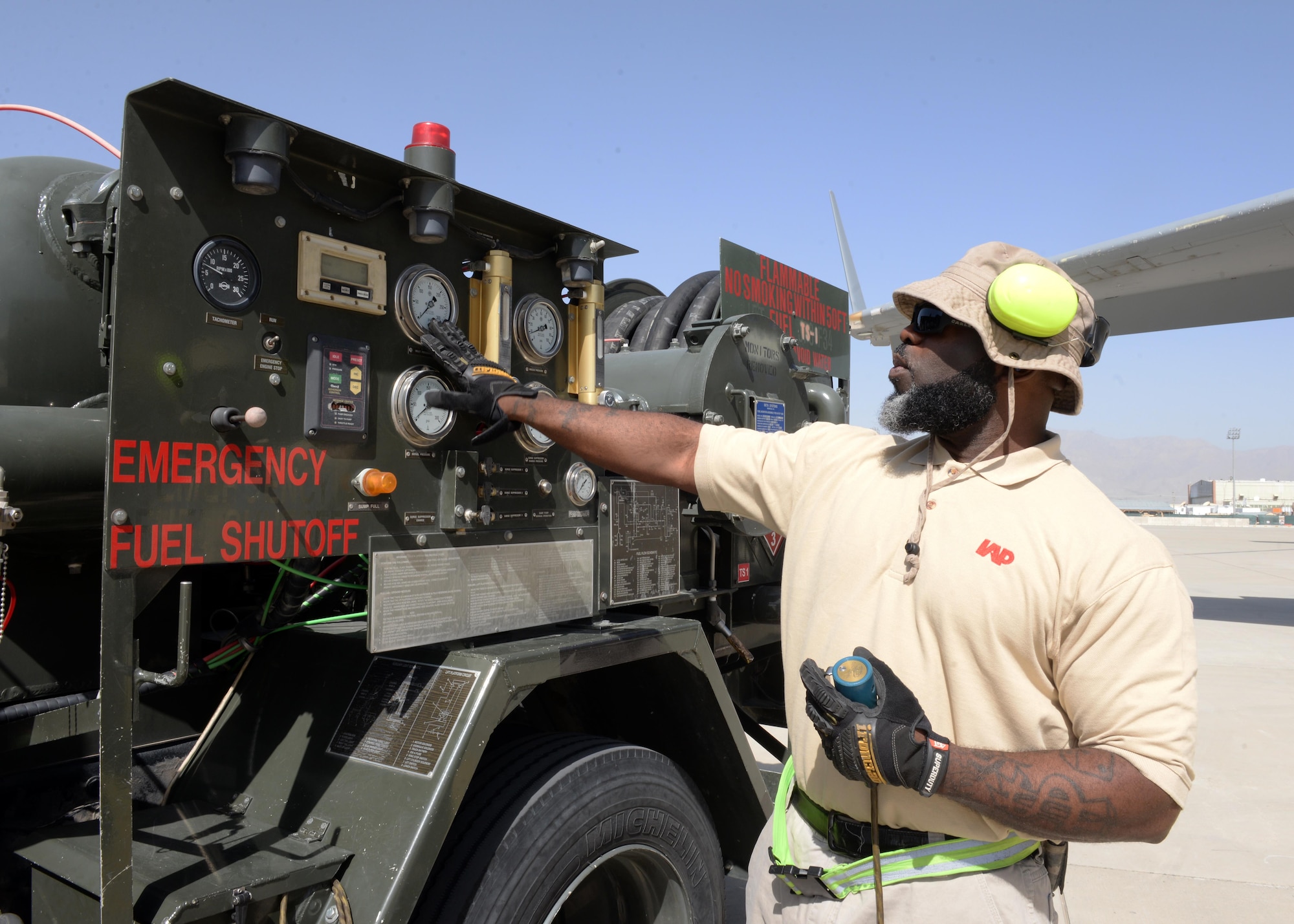 John Jackson, 455th Expeditionary Logistics Readiness Squadron fuels technician, prepares to fuel an aircraft using an R-12 hydrant system truck Aug. 22, 2015, on Bagram Airfield, Afghanistan. Jackson is a contractor with the Ingenuity and Purpose contracting company and is responsible for fueling all aircraft that come to and from Bagram. (U.S. Air Force photo by Senior Airman Cierra Presentado/Released)