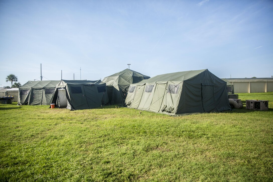 A Navy Tactical Operations Center rests in a field aboard Naval Station Mayport, Fla., during a Marine Prepositioning Force Exercise, Aug. 11, 2015. The TOC maintained the flow of communication between Marines with Combat Logistics Regiment 25 at Marine Corps Support Facility Blount Island, and sailors with Navy Beach Group-2, ensuring that both commands are in sync and those operations during the Marine Prepositioning Force Exercise ran smoothly. (U.S. Marine Corps photo by Sgt. Shawn Valosin/Released)