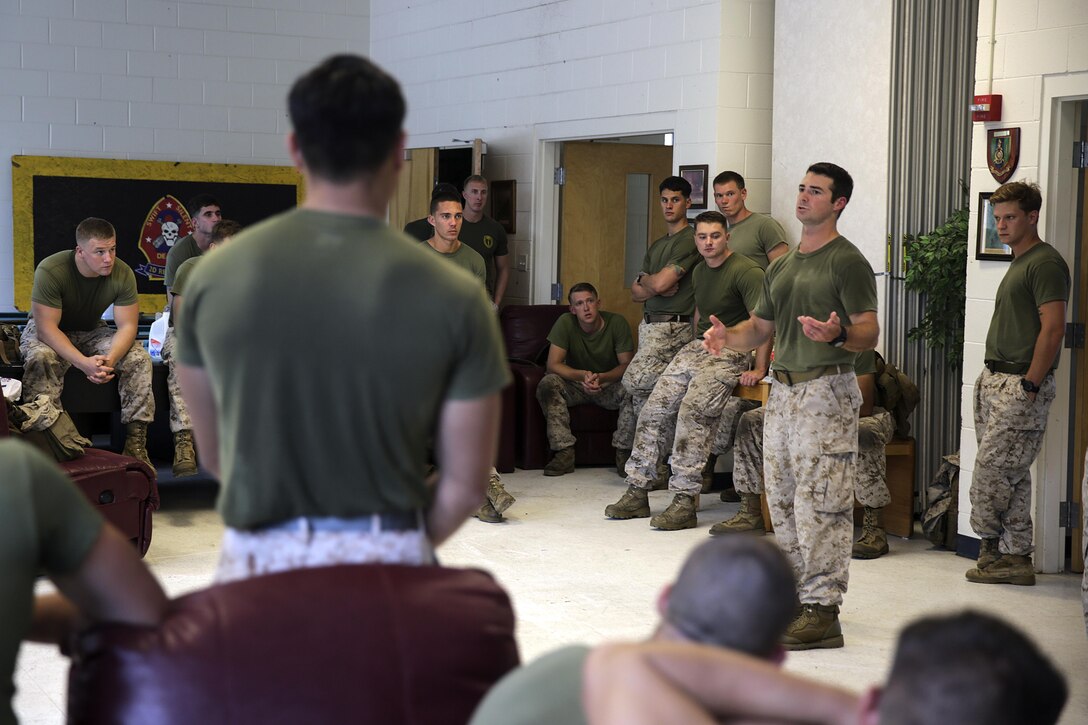 Petty Officer 2nd Class Greg Norman, a special amphibious reconnaissance corpsman with 2nd Reconnaissance Battalion, 2nd Marine Division, explains how a casualty collection point is coordinated with patients during a tactical combat casualty care course aboard Camp Lejeune, N.C., Aug. 8, 2015. More than 50 Marines with 2nd Recon participated in the course, which included classroom instruction, practical application, testing, and a final event where the Marines used the skills and knowledge to complete a final evaluation. (U.S. Marine Corps photo by Cpl. Alexander Mitchell/released)