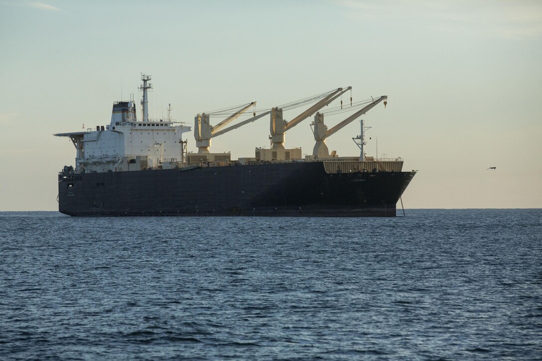 The USNS 1st Lt. Jack Lummus awaits offload during an in-stream Marine Prepositioning Force Exercise, Aug. 19, 2015. Marines with Combat Logistics Regiment 25 and sailors with Naval Beach Group 2 joined forces for the latest iteration of MPFEX, which saw service members offloading the Lummus using Lift-on/Lift-Off and Roll-on/Roll-off procedures off the coat of Marine Corps Support Facility Blount Island, Fla. (U.S. Marine Corps photo by Sgt. Shawn Valosin/Released)