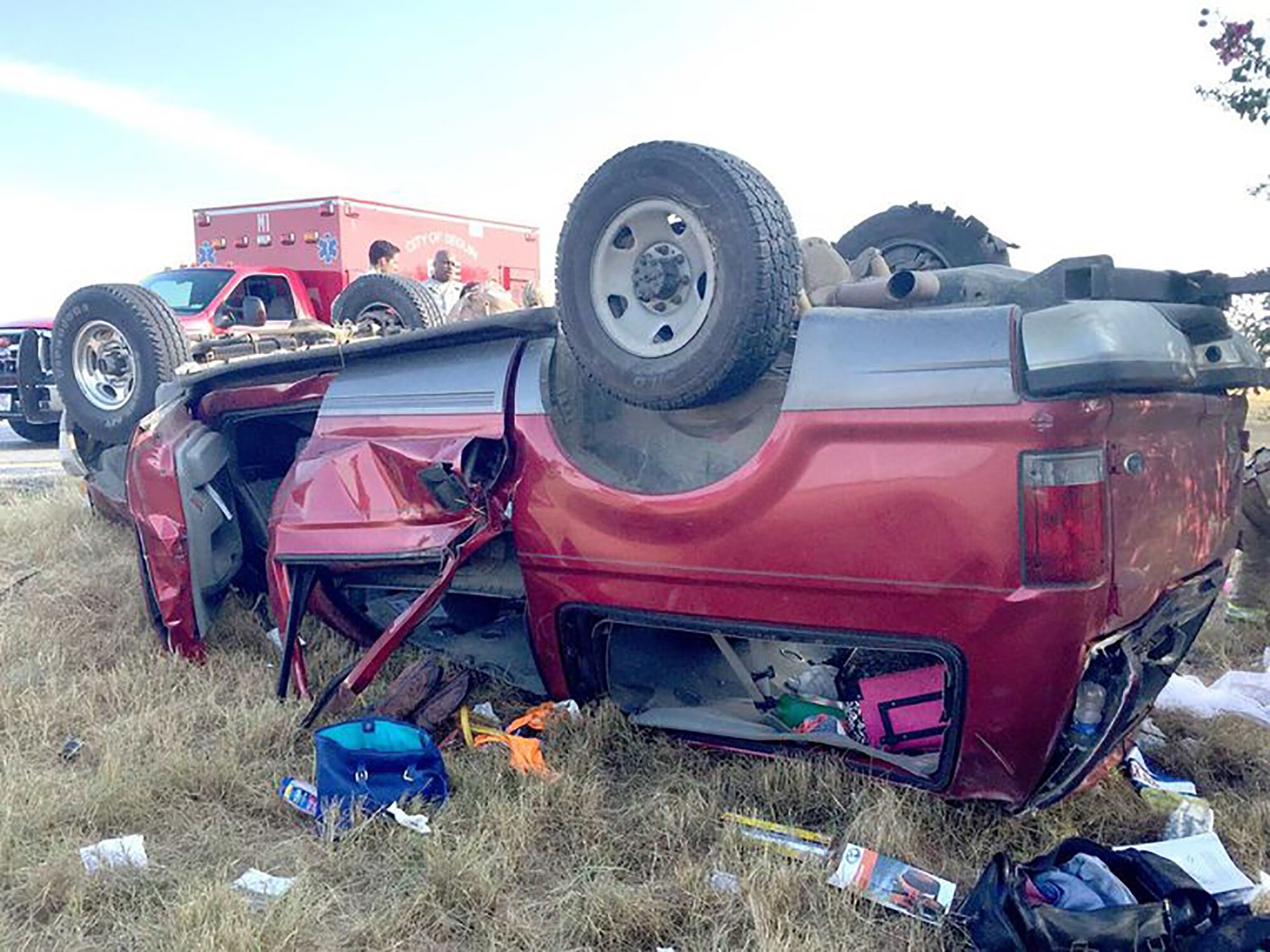 An overturned Ford Excursion rests in the median after rolling over, seriously injuring all six passengers on August 16, 2015 near Interstate 10 East. Four 433rd Airlift Wing Airmen stopped and provided immediate care to the injured passengers until first responders arrived on scene. (Courtesy photo/Seguin Gazette)