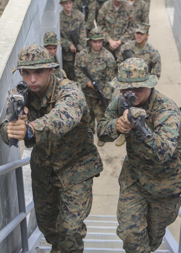 Marines with Support Company, 2nd Combat Engineer Battalion, practice clearing a stairwell of all enemy presence while their squad observes during Basic Urban Skills Training at Fort A.P. Hill, Va., Aug. 6, 2015. The training, which was taught by instructors from the 2nd Marine Division Training Center, was part of the battalion’s deployment for training exercise where the Marines improved the basic infantry skills they might not use on a daily basis. (U.S. Marine Corps photo by Cpl. Michelle Reif/Released)