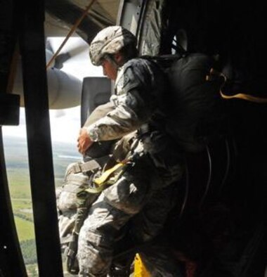 Pfc. Alonte Smith, a paratrooper assigned to the 82nd Airborne Division Artillery, jumps from a 440th Airlift Wing, Air Force Reserve C-130 onto Avon Park Air Force Range in Florida on Aug. 13 as part of the 82nd Airborne Division Association Convention. (U.S. Army photo by Capt. Joe Bush) 