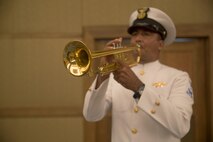 A member of the Colombian Naval Band plays taps during the opening ceremony of the Marine Leaders of the Americas Conference 2015 in Cartagena, Colombia, Aug. 24, 2015. The conference provides a forum for regional and senior naval infantry leaders throughout the Western Hemisphere to discuss shared interests in humanitarian assistance and disaster relief matters and improve training programs among partner nations. (U.S. Marine Corps photo by Sgt. Alisa J. Helin/Released)