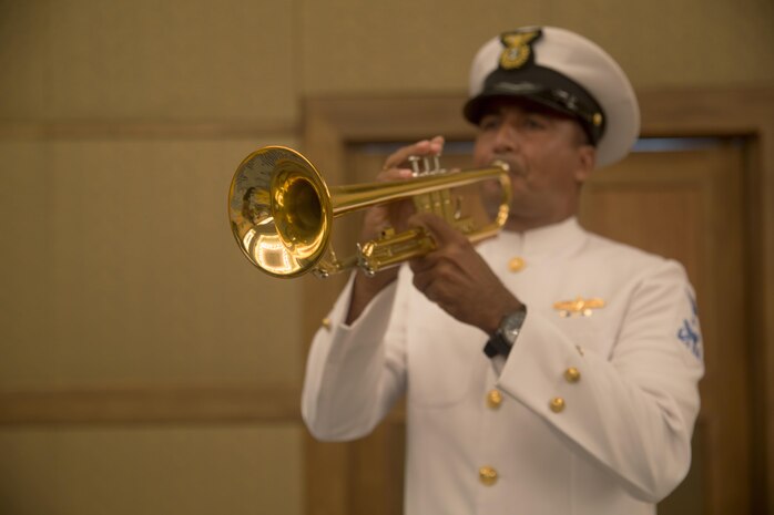 A member of the Colombian Naval Band plays taps during the opening ceremony of the Marine Leaders of the Americas Conference 2015 in Cartagena, Colombia, Aug. 24, 2015. The conference provides a forum for regional and senior naval infantry leaders throughout the Western Hemisphere to discuss shared interests in humanitarian assistance and disaster relief matters and improve training programs among partner nations. (U.S. Marine Corps photo by Sgt. Alisa J. Helin/Released)