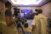 Colombian news media prepare to ask questions during a press conference at the Marine Leaders of the Americas Conference 2015 in Cartagena, Colombia, Aug. 24, 2015. The conference provides a forum for regional and senior naval infantry leaders throughout the Western Hemisphere to discuss shared interests in humanitarian assistance and disaster relief matters and improve training programs among partner nations. (U.S. Marine Corps photo by Sgt. Alisa J. Helin/Released)