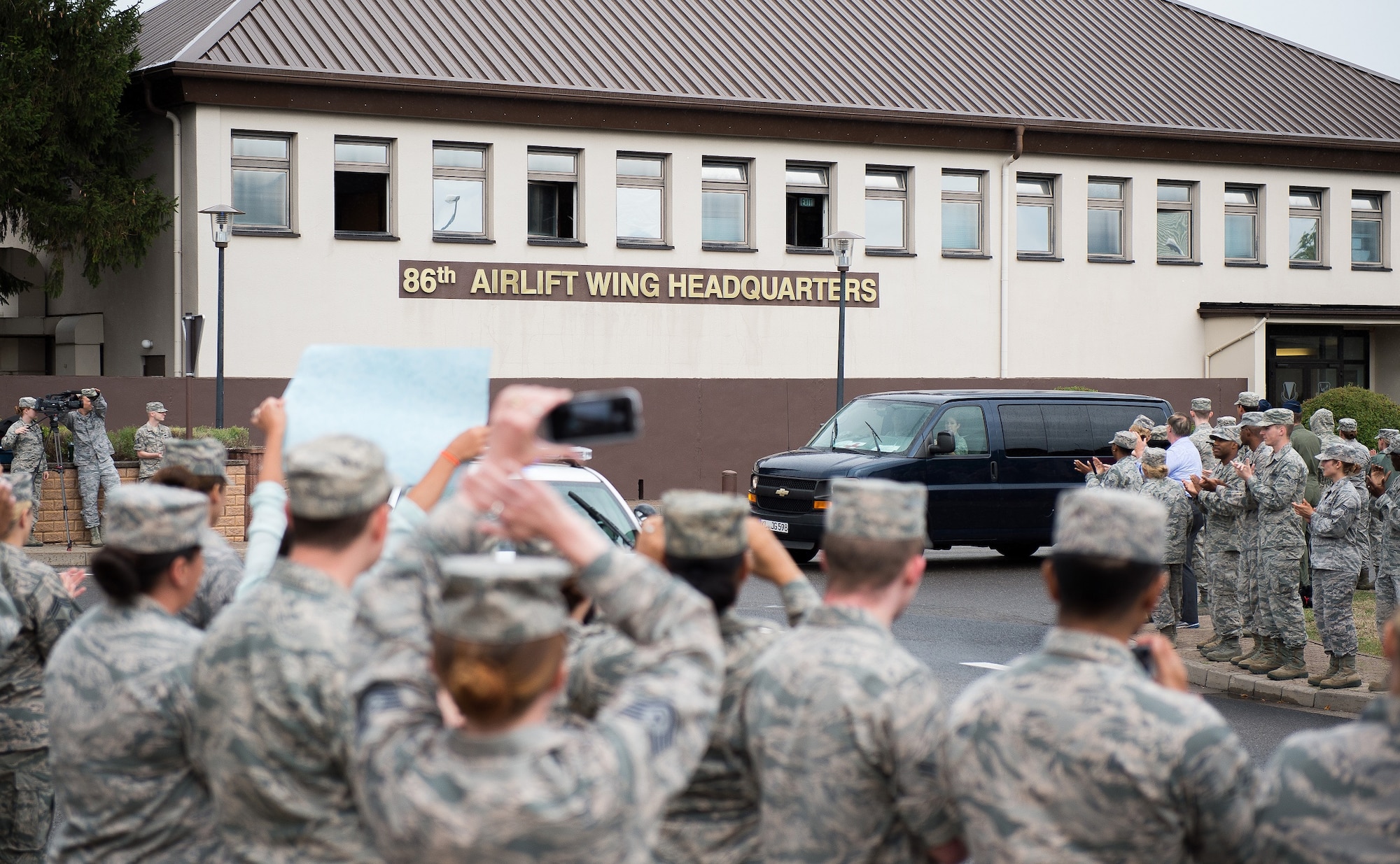 More than 500 service members and civilians line the streets of Ramstein Air Base, Germany, Aug. 24, 2015, to applaud Airman 1st Class Spencer Stone and Aleksander Skarlatos, an Army specialist in the Oregon National Guard, for their recent heroic actions in France. Stone is an ambulance service technician with the 65th Medical Operations Squadron at Lajes Field, Azores. (U.S. Air Force photo/Senior Airman Damon Kasberg)