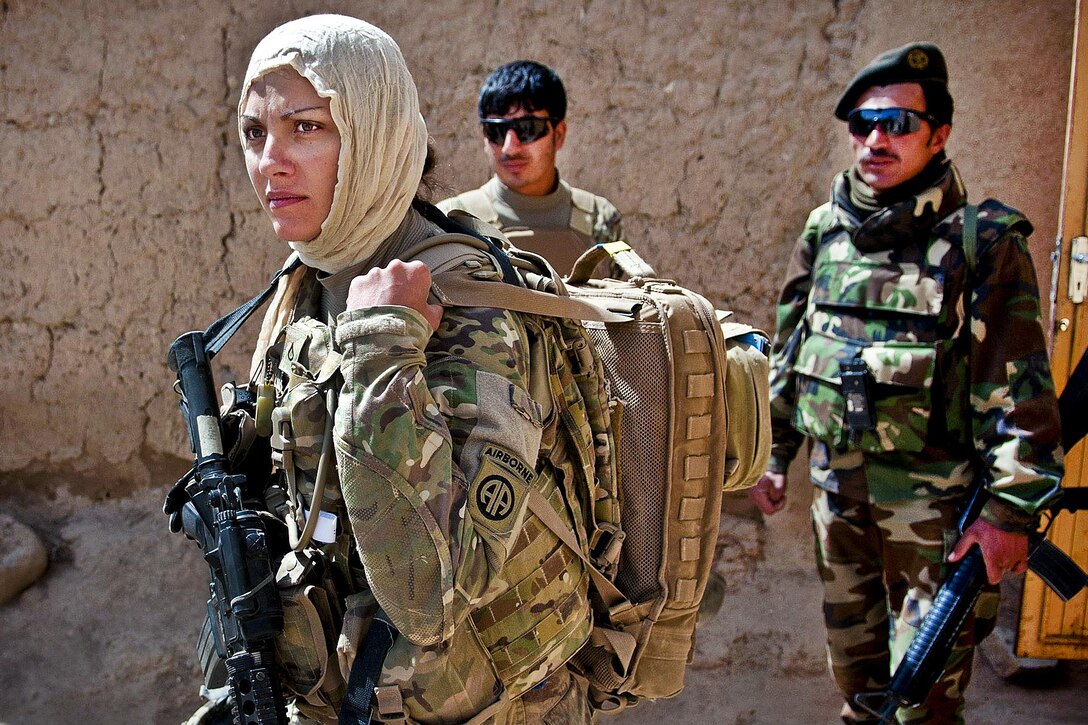 U.S. Army Pfc. Kristina Batty dons a headscarf to meet with female Afghan villagers in Ghazni province, Afghanistan, May 5, 2012.    Battym a medic assigned to the 82nd Airborne Division’s 1st Brigade Combat Team, is joining Female Engagement Team members to discover what females of the village need. U.S. Army photo by Sgt. Michael J. MacLeod