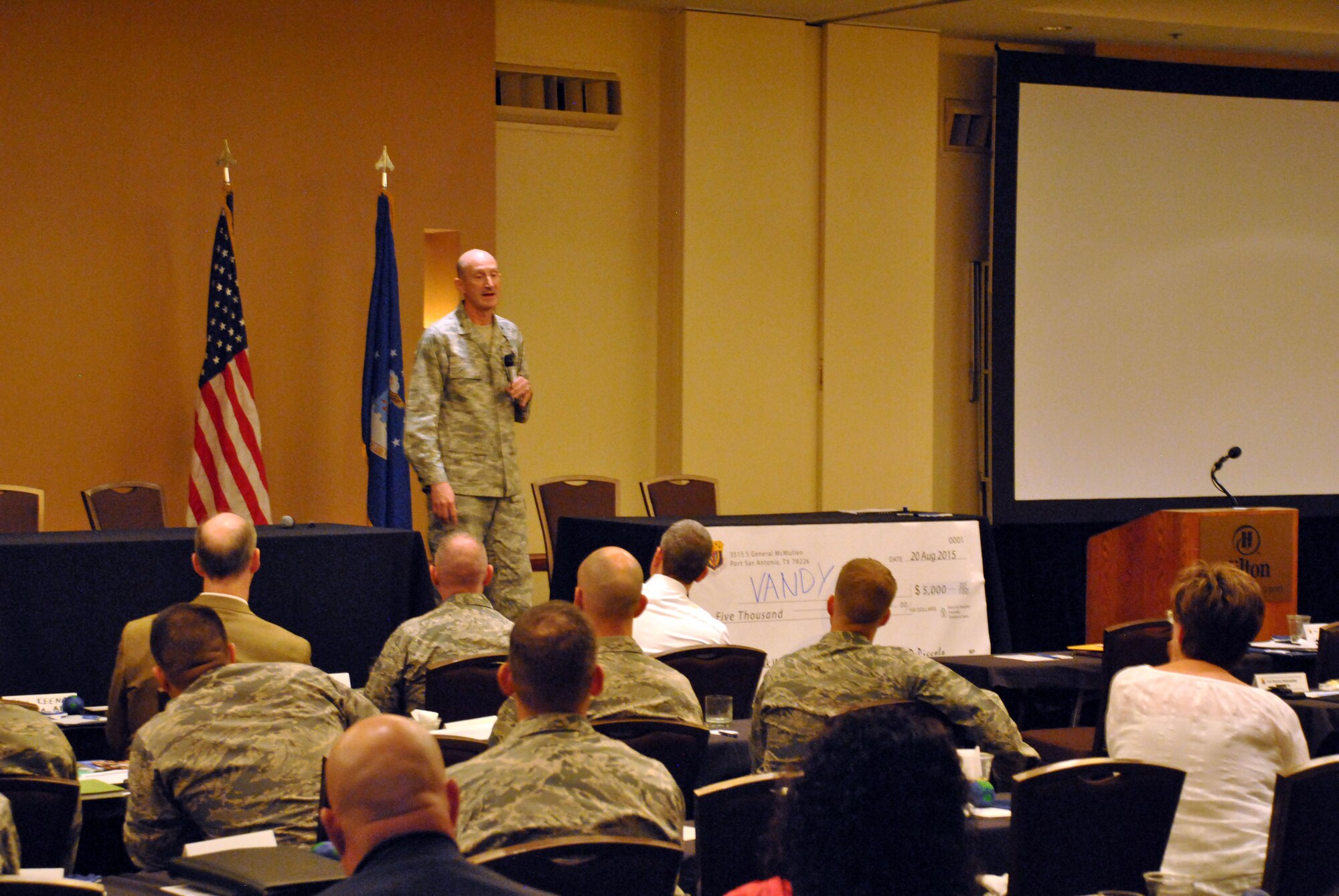 Air Force Services Activity commander Col. Marc Piccolo gives a talk at the AFSVA Force support squadron Commanders Training Event, hosted August 17-20, 2015, in San Antonio for FSS commanders and civilian leaders to learn about the present state of force support programs, future developments, innovation and network with each other. (U.S. Air Force photo/Master Sgt. Christian Michael/RELEASED)