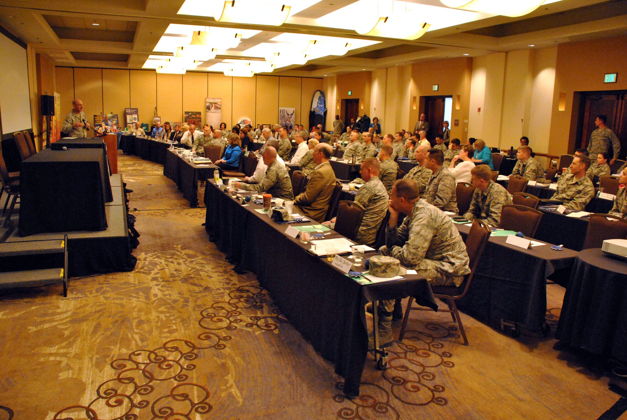 Force support squadron commanders watch Air Force Services Activity commander Col. Marc Piccolo give a talk at the AFSVA FSS Commanders Training Event, hosted August 17-20, 2015, in San Antonio for FSS commanders and civilian leaders to learn about the present state of force support programs, future developments, innovation and network with each other. (U.S. Air Force photo/Master Sgt. Christian Michael/RELEASED)