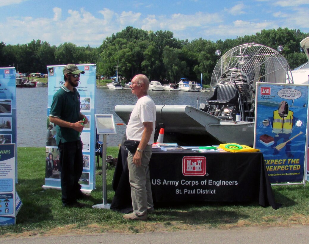 Jake Zanon, a survey technician in the St. Paul District’s Channels and Harbors Section, talks to a visitor at Red Wing River City Days on Saturday, August 1, 2015. The annual event, located on the banks of the Mississippi River in Red Wing, Minn., is a great opportunity for the Corps to reach out to the public and show off everything the District does. The display also included the district’s airboat, a piece of equipment that is used often during the winter months and is commonly seen and heard by visitors that attend the festival. The annual two-day event attracts an estimated 25,000 visitors from the region.