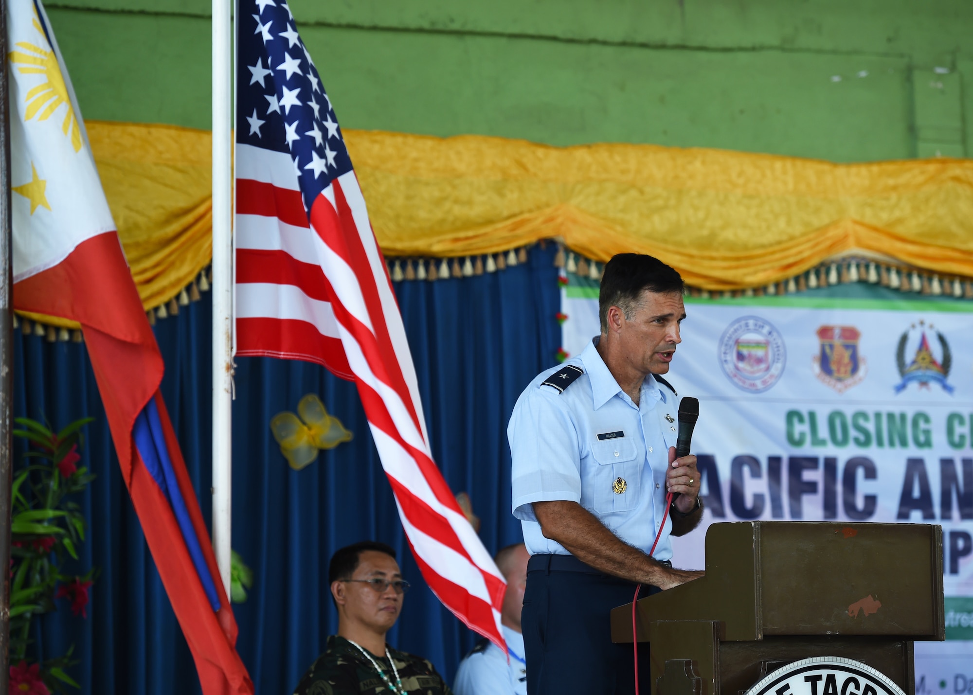 U.S. Air Force Brig. Gen. John Hillyer, mobility assistant to the chief of staff, Pacific Air Forces, speaks during the closing ceremony of Pacific Angel Philippines 15-1 in Bohol Province, Philippines, Aug. 24, 2015. Over the course of six days, 5,101 patients received health care and six different schools were refurbished providing rehabilitated learning space to approximately 5,000 students. Pacific Angel is a multilateral humanitarian assistance civil military operation, which improves military-to-military partnerships in the Pacific while also providing medical health outreach, civic engineering projects and subject matter exchanges among partner forces.(U.S. Air Force photo by Tech. Sgt. Aaron Oelrich/Released)