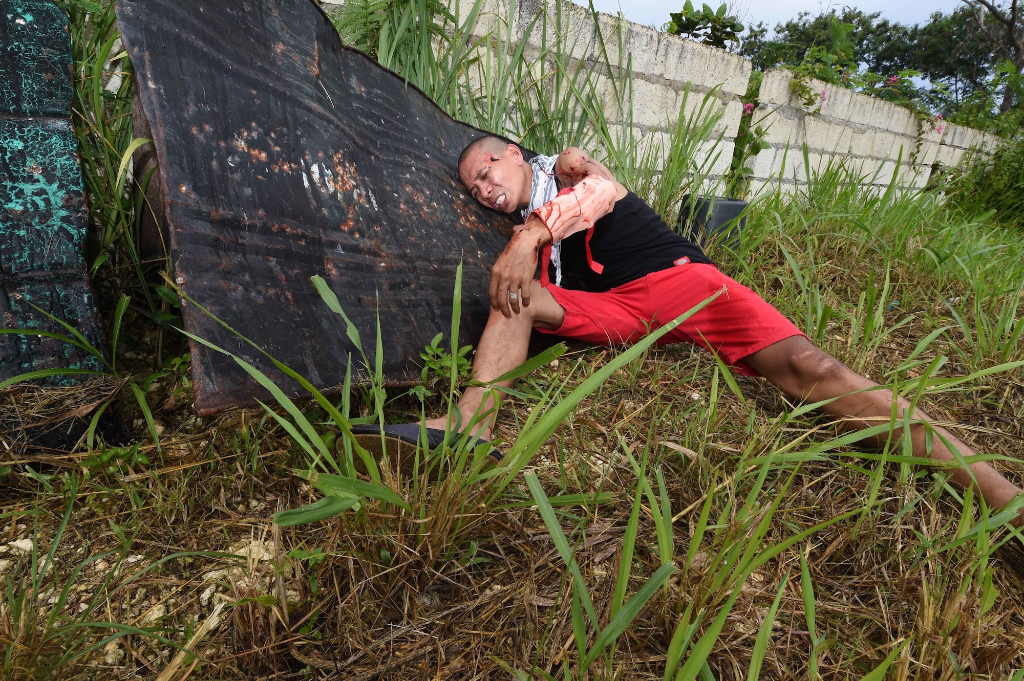 A patient acts out a simulated injury during a mass-casualty exercise that was a part of Pacific Angel Philippines, Bohol province, Philippines, Aug. 21, 2015. The mass-casualty exercise was the culminating event of a five-day subject matter expert exchange between the U.S. Defense Institute for Medical Operations, the Armed Forces of the Philippines, the Philippine National Police, the Telephone and Radio System Integrated Emergency Response, the Provincial Heath Care Unit and the City Heath Care Unit. Pacific Angel is a multilateral humanitarian assistance civil military operation, which improves military-to-military partnerships in the Pacific while also providing medical health outreach, civic engineering projects and subject matter exchanges among partner forces. (U.S. Air Force photo by Tech. Sgt. Aaron Oelrich/Released)