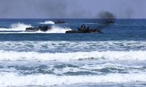 Marines with Headquarters and Service Company, 3d Assault Amphibian Battalion, 1st Marine Division, maneuver their Amphibious Assault Vehicle to the shore aboard Marine Corps Base Camp Pendleton, Calif., after exiting the well deck of amphibious transport dock ship USS New Orleans (LPD18), during a training exercise, Aug. 22, 2015. The purpose of the training was to provide surf qualification training for the battalion’s crew members. (U.S. Marine Corps photo by Staff Sgt. Bobbie A. Curtis)