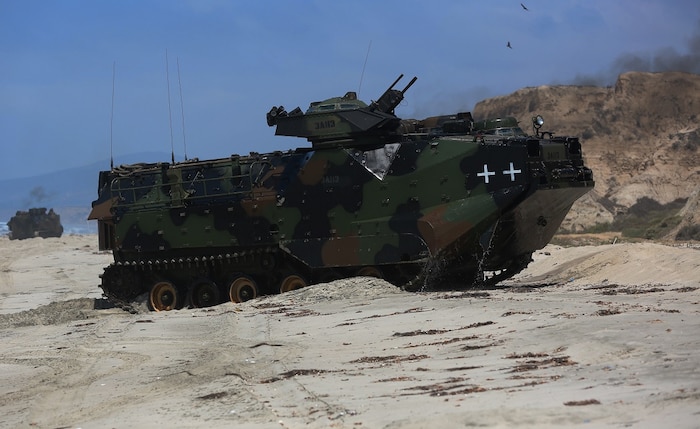 Marines with Company A, 3d Assault Amphibian Battalion, 1st Marine Division, maneuver their Amphibious Assault Vehicle to the shore aboard Marine Corps Base Camp Pendleton, Calif., after exiting the well deck of amphibious transport dock ship USS New Orleans (LPD18), during a training exercise, Aug. 22, 2015. The purpose of the training was to provide surf qualification training for the battalion’s crew members. (U.S. Marine Corps photo by Staff Sgt. Bobbie A. Curtis)