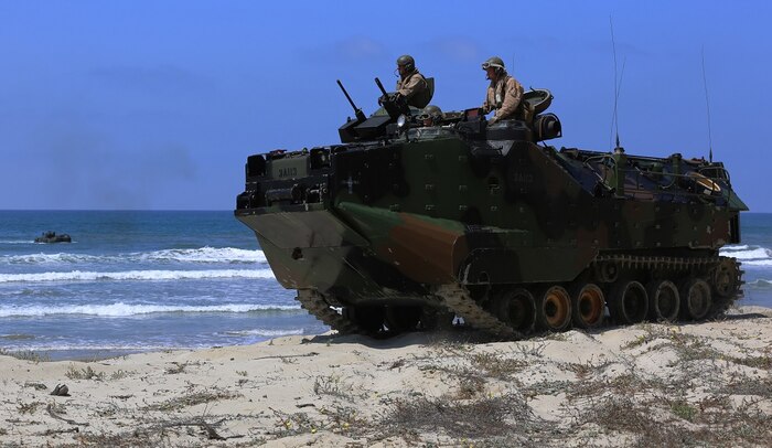 Marines with Company A, 3d Assault Amphibian Battalion, 1st Marine Division, maneuver their Amphibious Assault Vehicle to the shore aboard Marine Corps Base Camp Pendleton, Calif., after exiting the well deck of amphibious transport dock ship USS New Orleans (LPD18), during a training exercise, Aug. 22, 2015. The purpose of the training was to provide surf qualification training for the battalion’s crew members. (U.S. Marine Corps photo by Staff Sgt. Bobbie A. Curtis)